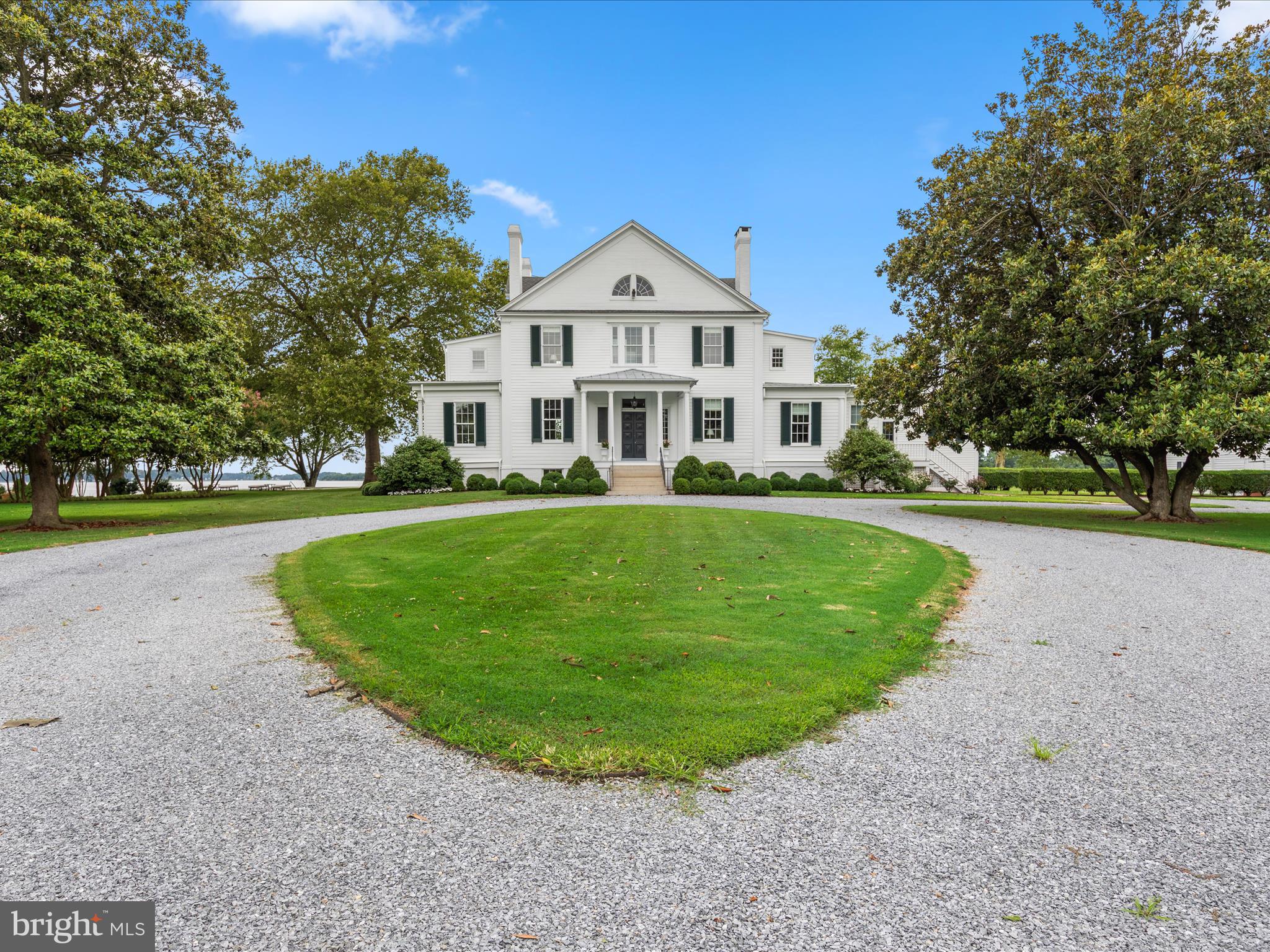 Presquile Manor House, originally built by the Lloyd Family circa 1800 as one of their three Plantation Houses, sits up high on the Wye River with due West Exposure.  The Main House has recently gone through a two-year renovation process from top to bottom by West & Callahan Construction and Peter Zimmerman Architects Inc, with much thought and care to keep all of the historic attributes that this property deserves. The grounds are improved by a pool, tennis court, covered boat house with deep water, formal gardens, magnificent mature trees and a detached 1,670 sq ft caretaker's house. The main parcel is 10.48 acres with an additional 7.1-acre tree lined drive with a perpetual easement.  This is a one-of-a-kind property and a true Talbot County piece of History. Furniture is negotiable.