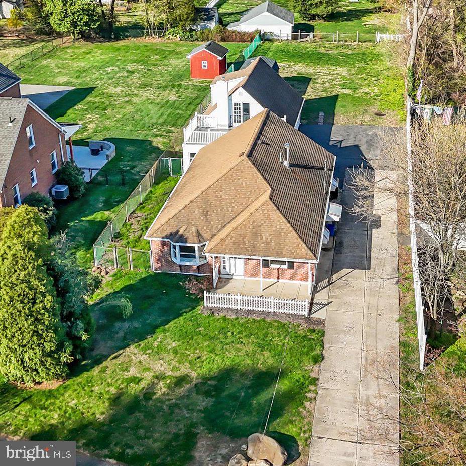 Don't miss out on this unique property situated on a deep lot which lends itself to many possibilities with its detached dwelling that can be utilized as an in-law suite, studio, home office and more.  The main house features fresh pain throughout, and newly remodeled kitchen.  The kitchen features white shaker cabinets with soft close doors, ceramic subway tile backsplash, granite countertop with stainless sink, pull out faucet and garbage disposal, new waterproof laminate flooring, crown molding, recessed lighting, remote ceiling fan, new Frigidaire appliance package with side by side refrigerator with ice/water in door, slide-in steam clean oven, built-in dishwasher and microwave, and breakfast counter overlooking living room, great for entertaining. Laundry/mud room located off kitchen with washer/dryer hookup, laundry tub, heater closet and door to side yard. Spacious living room with decorative cement flooring, crown molding and large bay window for lots of natural sunlight.  Main first floor bedroom has full bath with tub/shower, ceramic tile walls and floors, and double closets.  Second first floor bedroom, hallway with half bath with ceramic tile floor and walls. Oak finished staircase to second floor with third bedroom which features new wall to wall carpet, sliding glass door to garage roof, full bath with shower stall, ceramic tile walls and flooring, pedestal sink, built-in medicine cabinets and heat light.  Fourth room with wall-to-wall carpet and recessed lighting is currently being utilized as a closet with built-in racks and could easily be converted to office or bedroom.  Exterior features architectural shingled roof, brick exterior, newer exterior doors, front covered cement porch with white picket fence and recessed lighting, exterior lighting around property, 12+ car cement/macadam driveway perfect for parking your campers, boat, trailer, extra cars etc.  Fenced in yard with chain link and 6' PVC fencing, 12x20 barn style wooden shed with double doors and built-in loft storage.  Extras include oil two zone baseboard heat with above ground oil tank, central air, 200-amp circuit breaker system, attached one car garage with recoated flat roof and replaced garage door, The freshly painted attached dwelling off of the garage was used as additional living space for a family member. The first floor has a room with built-in wall cabinets ceramic tile flooring and large storage closet/pantry, a full bath with closet containing washer/dryer hookup, two additional rooms with ceramic tile floors, one has a heater closet and door to garage, the other is a spacious room with two ceiling fans.  The newly carpeted stairway leads to second floor with addition newly carpeted room with sliding door to garage roof and second smaller room with wall-to-wall carpeting.  Exterior features include architectural roof, maintenance free vinyl siding and newer exterior door.  Extras include new central air unit, newer oil heater with baseboard heat/summer winter hookup for domestic hot water and above ground oil tank, 100-amp circuit breaker system.  Convenient to I95 and Cornwells train station and NJ bridges.  Don't miss out! Take advantage of this rare opportunity. A property such as this only comes on the market once in a great while. Available for quick settlement!