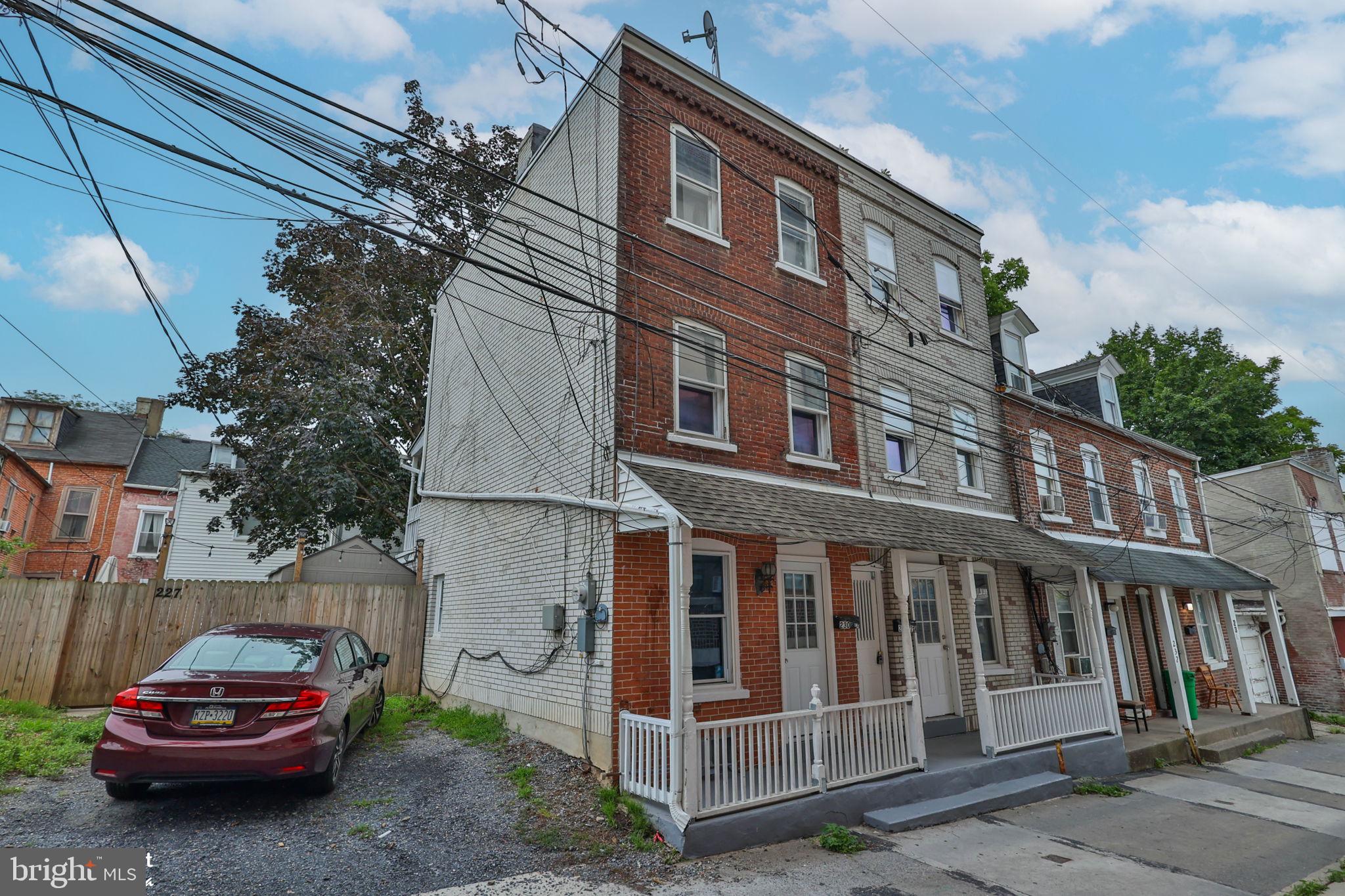 Discover this end of row home in Allentown's Historic District. This property offers a versatile living arrangement, ideal for owner-occupancy with the added benefit of potential rental income. The main level encompasses a comfortable living room, a functional eat-in kitchen, and a conveniently located full bathroom, fulfilling essential daily requirements. The second floor features two inviting bedrooms and a charming balcony, perfect for enjoying the local atmosphere. Further enhancing the living space, the third floor provides two additional bedrooms, offering flexible options for diverse needs. The residence includes full basement, with washer/dryer hookups and ample storage, contributing to practical urban living. A private, fenced-in yard offers a serene outdoor sanctuary for leisure and gatherings. The property's classic brick exterior ensures enduring appeal, harmoniously blending with the dynamic environment of Allentown City. Embrace the lifestyle provided by this unique home, which thoughtfully combines historical charm with contemporary comfort and significant income-generating potential. Promptly schedule a viewing to explore the myriad possibilities this property affords.