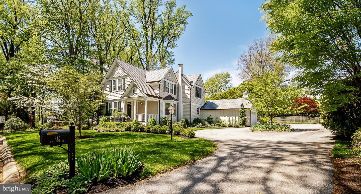 Welcome to 213 Pine Tree Road, Wayne, PA – A Rare Gem 
This meticulously updated Victorian Carriage House, originally part of the historic Berwind Estate, seamlessly blends early 20th-century charm with modern luxury for today's lifestyle.  This residence is sited on a spacious, beautifully landscaped, one-acre lot, perfectly located in the coveted Northwoods neighborhood of Radnor Township. The property offers 4 bedrooms, 2 full and 2 half bathrooms, a new roof, copper gutters, all new siding and approximately 3,070 square feet of living space.
Step inside to an inviting floor plan featuring hardwood floors, abundant natural light, and thoughtful updates throughout. A gracious Center Hall is open to a grand step-down Living Room which is light-filled and features a vaulted ceiling, expansive windows, sliding glass doors, custom built-ins, powder room, and a cozy gas fireplace.  The formal dining room with lovely crown molding and mill work is accessible from the hallway and the kitchen.  The gourmet custom Plato kitchen showcases every luxury a chef could want including a Sub-zero fridge, 4-burner professional Thermador range, a custom-built Grothouse walnut island top and natural stone countertops. The kitchen flows into a completely open concept Family room, with a awesome gas fireplace, Flat Screen TV, walls of windows and sliding doors, the 2nd Powder room and first floor Laundry.  An adjacent auxiliary room, currently utilized as an office, can easily be a Breakfast room or a kid’s playroom.  The Primary bedroom suite is filled with natural light on three sides.  It has a vaulted ceiling, generous custom closet space and a lovely en-suite bath with natural stone.  Three additional good-sized bedrooms and a full hall bath complete the second floor.  
The flagstone patio is accessed through French doors from the family room and included a pergola with newly added electric and a professionally redesigned French Drain with boxwood surround . . .   an entertainer's dream or just a quiet place to relax.  The private flat rear yard is enhanced by beautiful professionally designed gardens, gracious trees, a second brick patio with firepit, a charming playhouse or storage shed and an expansive completely fenced lawn. A circular driveway offers plenty of parking in addition to the two-car detached garage. 
This is a very special house and property.  It is located close to Wayne, has award winning Radnor Schools, is in close proximity to parks, walking trails, restaurants, shopping, major highways and all the amenities the Main Line has to offer.