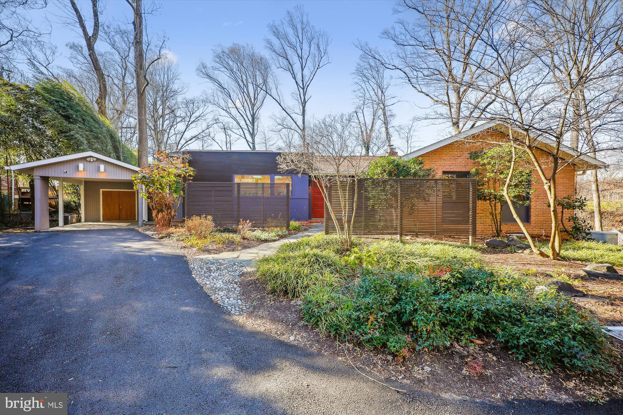 PRISTINE AND ABSOLUTELY  GORGEOUS!  Welcome to 8328 Fenway Road, a beautifully renovated and freshly painted Mid-Century Contemporary home in the highly sought-after Carderock Springs neighborhood of Bethesda. This distinctive property is perfectly positioned on a 0.52-acre lot, adjacent to the golf course at the prestigious Congressional Country Club—one of the most desirable locations in the community, just steps to the community pool and tennis courts.
This expanded, sunlit five-bedroom, three-full-bath home boasts exceptional design and flow, featuring walls of windows, vaulted ceilings, skylights, recessed lighting, custom built-ins, gorgeous wood flooring, and thoughtfully crafted living spaces. The home’s inviting foyer opens into a stunning living room with a fireplace framed by custom cabinetry, floor-to-ceiling windows, and access to a picturesque deck. 
At the heart of the home is the open-concept dining room, family room, and kitchen—perfectly configured for entertaining and daily living. The chef’s kitchen is a showstopper, featuring a large center island, elegant veined solid-surface counters, and premium appliances, including a Miele microwave, two Asko dishwashers, a Sub-Zero refrigerator, a Blue Star professional-style range with a striking Zephyr hood, and a Sub-Zero wine fridge. Handsome cabinetry and skylights complete the space. The dining room, with its modern chandelier and sliding glass doors to the expansive deck, seamlessly blends indoor and outdoor living. The family room offers gabled ceilings, clerestory windows, and a wall of custom built-ins, creating a remarkable gathering space. Just off the family room, you’ll find a convenient drop zone area with access to the carport and driveway.
The main level includes three bedrooms and two renovated full baths, highlighted by the luxurious primary suite. The primary bedroom offers a spacious private bath, a walk-in closet, two additional closets, and bucolic views. The renovated en suite bath is a true retreat, with vaulted ceilings, an air jetted soaking tub, a double vanity with granite counters, a glass-enclosed shower, and floor-to-ceiling ceramic tile.
The walk-out light-filled lower level has a spacious recreation room with recessed lighting and access to the backyard. It also features two additional bedrooms, a modern full bath, a versatile gym, a small office, and a large laundry/storage room.
The home’s exterior is equally impressive, with a detached carport with built-in storage, a welcoming covered front entry, an expansive deck, a circular stone patio, and lush landscaping with mature plantings. Recent updates include a new roof, dryer, heat pump, and water heater.
Carderock Springs is a vibrant community known for its mature landscaping, community pool, pool house, and tennis courts. Ideally located just outside the Beltway, it provides easy access to DC, Northern Virginia, I-270, and downtown Bethesda’s renowned dining, shopping, and entertainment options. Whitman school cluster. 
This home is a true masterpiece, combining an idyllic park-like setting, breathtaking wooded views, and exceptional livability. Don’t miss this rare opportunity to own a one-of-a-kind property in Carderock Springs.
Schools: Carderock Springs Elementary School, Pyle Middle School, and Whitman High School