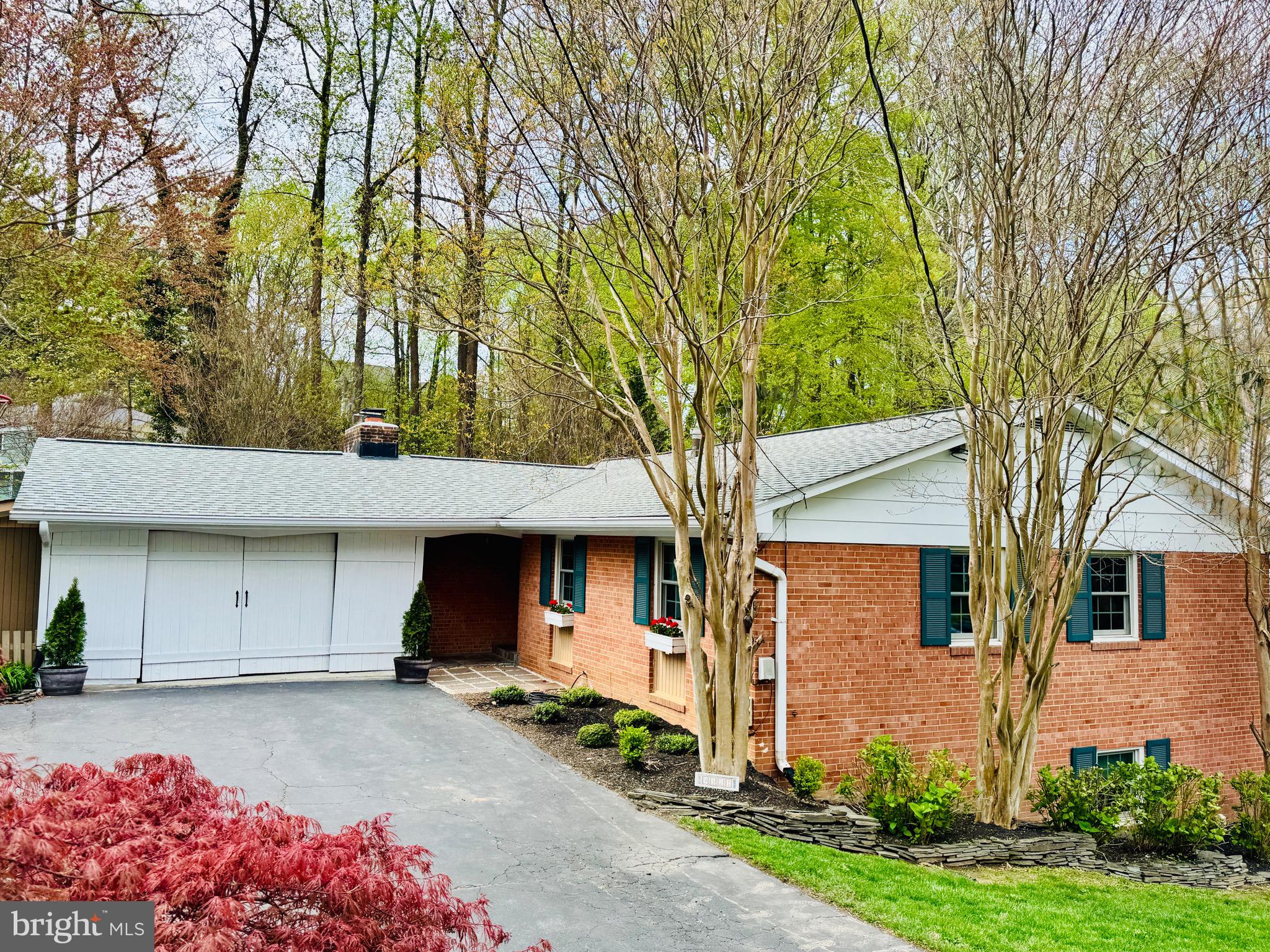 Move in ready, updated brick rambler 1 block to Mantua Swim and Tennis Club and 2 blocks to the Cross County Trail.  OVER 2,800 FINISHED SQUARE FEET.  5 BEDROOMS, 3 BATHS.A spectacular outdoor entertaining space, plus beautiful screened in porch and expansive deck. Living room has a wood burning fireplace.  Updated kitchen with granite countertops and stainless steel appliances.  Eat in area and built in bench in kitchen.  Walk out lower level to flagstone patio, stone fireplace & fenced back yard. Family room with fireplace, 2 additional bedrooms, storage and laundry room and a cozy movie theatre/den /game room or exercise room.   2 fireplaces.  Hardwood floors throughout main level. Incredible plantings, landscaping, patios, and a recent hot tub that conveys. BRAND NEW FURNACE AND AC 2025. 2 space carport with barn doors is mostly enclosed.  Swim and Tennis  membership available for purchase -- buyer of home has first right of refusal to purchase the membership, avoid the 5 year wait list.  Short distance to Inova Fairfax Hospital, Mosaic Center, and great location for commuters; close to many major highways. Vienna and Dunn Loring Metros nearby. Woodson HS pyramid.  Open Saturday April 19,  2-4 pm.