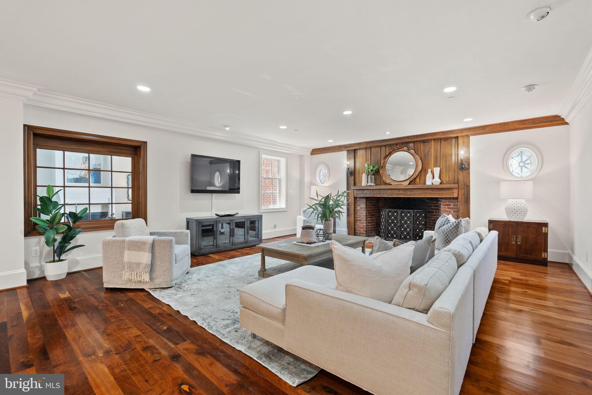 Discover unparalleled luxury living in the heart of Old Town Alexandria at 555 S Washington Street #101, a residence that embodies charm, history, and modern sophistication. Originally built before 1790, this distinguished property once served as a prestigious social club where prominent figures like President George Washington and George Mason gathered, making it a true gem in the fabric of American history.
This townhouse-style condo spans three glorious levels, offering far more space than meets the eye. From the moment you enter, you’ll be captivated by the exquisite details: beautiful walnut and Italian stone flooring, exposed wood beams, and the seamless blend of historic character with modern luxury. The recently renovated kitchen and bathrooms are equipped with top-brand stainless steel appliances, marrying style and function in every corner. The home features three indoor gas fireplaces and an outdoor gas fireplace, creating cozy, inviting spaces for every season. Vaulted ceilings elevate the sense of space, while the luxury primary suite offers a serene retreat with two walk-in closets featuring custom built-ins, and a private bath complete with a relaxing steam shower. Greet your guests from a charming front porch that leads to a private entrance, or entertain on the private patio that’s perfect for gatherings. A detached two-car private garage adds to the convenience and exclusivity of this remarkable home. Located in the heart of Old Town, you’re just steps away from fine dining, quaint boutiques, and endless community activities. With close proximity to the metro and other public transit options, and less than five miles to Reagan National Airport, this home offers both the serenity of historic charm and the convenience of modern living. Freshly painted and meticulously maintained, this residence is ready for its next chapter. Don’t miss this rare opportunity to own a piece of history with all the luxuries of today.
