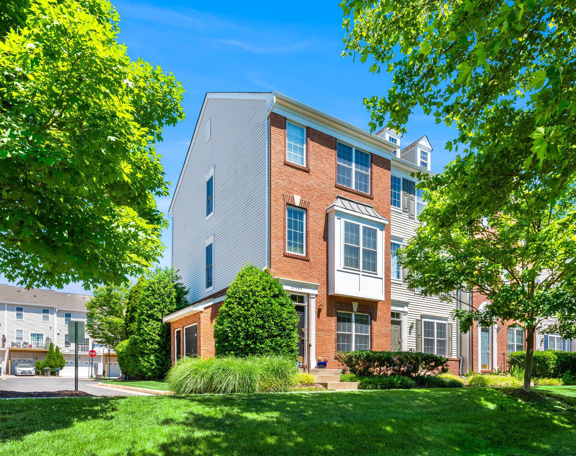 Freshly updated and ideally located in the heart of South Riding, this brick-front end-unit townhome offers the perfect blend of comfort, versatility, and convenience. Thoughtfully refreshed in 2026 with fresh paint throughout, brand-new carpet, a new refrigerator, a new oven, and a 2021 HVAC system, this move-in ready home is filled with natural light and designed for the way you live today.

Hardwood floors span the main level, where the sun-filled living room, dining area, and kitchen come together in an open-concept layout perfect for both everyday living and entertaining. The kitchen features stainless steel appliances, quartz countertops, ample cabinetry, and direct access to the balcony, creating a seamless connection between indoor and outdoor living. A convenient laundry closet with storage shelving and a powder room complete the main level.

Upstairs, dual primary suites offer exceptional flexibility and privacy. Each spacious bedroom features vaulted ceilings, a ceiling fan, walk-in closet, and private en suite bath, making the home ideal for roommates, guests, or multi-generational living.

The lower level offers a third bedroom with its own en suite full bath, creating the perfect space for guests, a home office, fitness room, playroom, or cozy den. A rear-entry two-car garage provides abundant parking and storage, while an additional parking pass allows for overnight parking in the community lot.

Beyond the home, enjoy all that South Riding has to offer. Residents have access to an exceptional collection of amenities including multiple pools, tennis and pickleball courts, sports fields and courts, tot lots, walking trails, a dog park, scenic ponds, and countless opportunities to enjoy the outdoors and connect with neighbors.

Perfectly positioned near the Dulles South Recreation Center, schools, grocery stores, restaurants, Home Depot, and everyday conveniences, this location also offers easy access to Route 50, Route 28, the Dulles Greenway, and Dulles International Airport.

Combining fresh updates, a flexible floor plan, and one of Loudoun County’s most amenity-rich communities, this South Riding home offers an exceptional opportunity to enjoy a lifestyle of comfort, convenience, and connection.