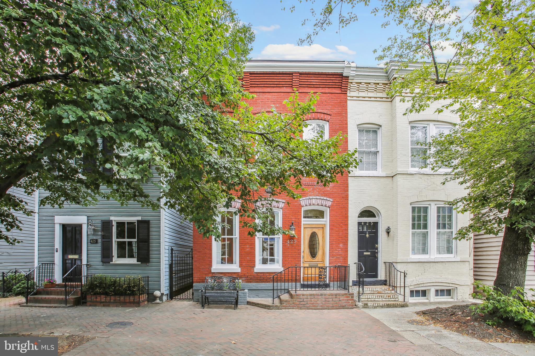 Be the first to live in this totally renovated house in Old Town’s desirable Southeast quadrant.  Over 2000 square feet of living space including an additional main level room that can function as a potential third bedroom, family room, or home office.  Modern elements blend effortlessly with historic Federal style architecture reflecting quality design and construction details of this move-in ready home.
Offering exposure on three sides, sunlight beams within throughout the day.  Custom millwork, two original fireplace mantels, original entry vestibule doors and hardware, refinished heart of pine floors and high ceilings greet you as you enter.  The elegant living room / parlor features a gas fireplace, original millwork baseboards, and the homes original pocket doors and hardware.  A charming main level powder room is dressed with Rifle Paper Company Wallpaper, warm brass fixtures, and elegant New Ravenna hand designed oval mosaic marble tile floors.  Enter the stunning kitchen from the separate, yet open formal dining room. The kitchen features Danby marble countertops and backsplash.  Danby marble is mined in Vermont from the oldest working quarry in the United States. Thermador appliances include an 84” built in refrigerator, dual fuel range, and a pull down style microwave wall oven.  A patented, seamless drain is just one unique feature of the 28-inch workstation ledge sink with several custom accessories.  Under cabinet lighting and Simon Pearce handcrafted glass pendants further reflect the elegance of the space adorned with inset door custom cabinetry crafted from maple wood, a 9-foot island complete with extra storage, and even more storage in a separate 36-inch wide pantry.  Continuing on the main level is  the additional room equipped with a built in desk area (pull out computer drawer and space for printer below), two 48-inch built in closets with separate overhead storage all inset design with Restoration Hardware pulls and knobs. This space can function as a main level bedroom, family room, or home office. The large back flagstone and brick patio is accessible from the back room or the kitchen via a side brick walkway, which spans the length of the home. 
Journey upstairs to the spacious bedrooms each with an en-suite bathroom.  Both en-suites feature custom low iron Starphire ultra clear shower glass doors, carrara marble top vanities, and Toto (bidet compatible) toilets. The primary bath features Kalista’s Central Park West Collection fixtures, New Ravenna marble tile floors, and a gorgeous custom fabricated marble stone step-up to a separate shower / free standing tub area featuring a custom millwork cased opening inspired by the homes original millwork design.  The primary bedroom has an outdoor patio to enjoy morning coffee. The front bedroom has a third original fireplace mantel, pocket window shutters, as well as a separate beautiful arched entry alcove perfect for an extra sitting area or even a charming nursery.  
A long hallway creates privacy between the bedrooms, offers more built in storage and a separate laundry closet featuring LG Ultra Large Capacity washer and dryer units with a tile floor and tile wainscot walls.  The home renovation included new plumbing, installation of a new electrical panel, and insulation added between the bathrooms including the adjacent laundry room walls.  
The home features several historical interior doors with porcelain knobs and transoms that were maintained or carefully repurposed during the renovation.  Emtex porcelain doorknobs, doorstops, and hardware are on all other interior doors in keeping with the period of the home. 

And location … situated near the Wilkes Street historic tunnel, walk a block east to Windmill Hill Park and one more to the Potomac River and Mount Vernon trail where one can stroll, enjoy a picnic or launch a kayak.  Head three blocks north and enjoy all that Old Town has to offer.