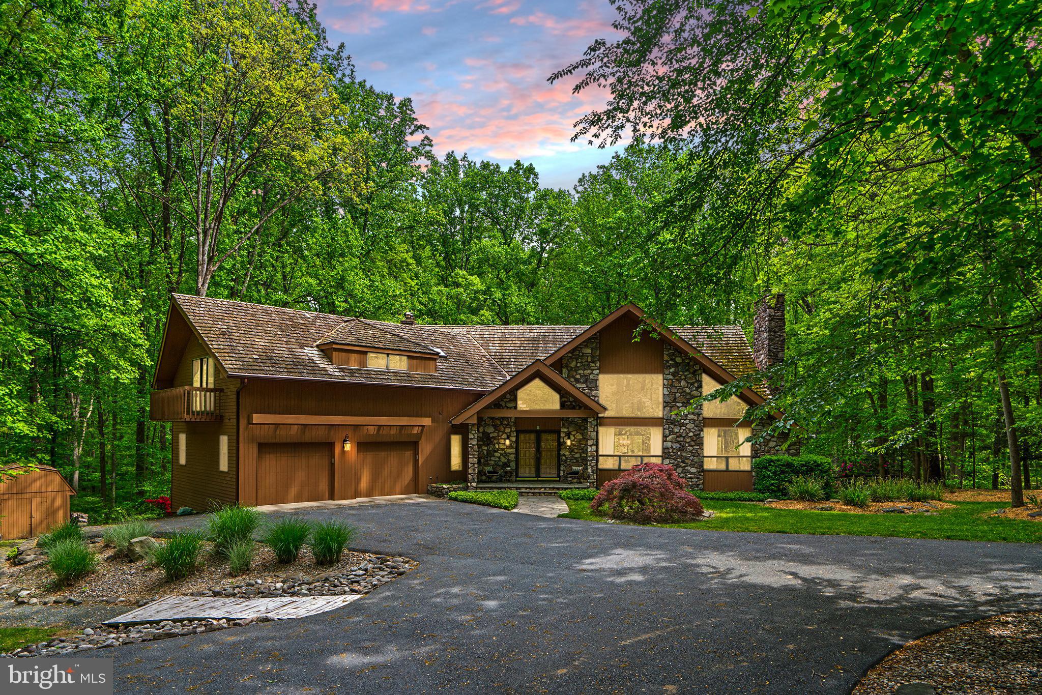 Step into your private Nature Retreat, where elegance and tranquility merge seamlessly in this custom-built estate boasting over 8,600 square feet of living space. Nestled on a 3+ acre lot that borders Gorman Park, this one-of-a-kind property offers unmatched privacy, scenic beauty, and direct access to outdoor recreation.

From the moment you enter the grand foyer, the home’s superior craftsmanship and thoughtful design are unmistakable. At the heart of the residence is a chef-inspired gourmet kitchen, complete with Wolf double ovens and cooktop, Sub-Zero paneled refrigerator, warming drawer, and abundant custom cabinetry—all highlighted by striking Caesarstone Quartz countertops.

The home offers 6 expansive bedrooms, including a serene primary suite with a two-sided fireplace, walk-in closet, and a private sitting room. A separate in-law/au pair wing provides a spacious bedroom with en-suite bath, dual walk-in closets, and its own laundry room, making it perfect for extended family or guests. Several bedrooms can easily adapt into offices, playrooms, or creative spaces, offering flexibility to suit any lifestyle.

Entertainment and relaxation come effortlessly here. Host movie nights in the state-of-the-art media room with luxury seating for eight, recharge in the home gym and spa area featuring a hot tub and dual changing rooms, or step outside to enjoy the resort-style saltwater pool and multi-level deck. The lush backyard includes a tranquil koi pond and overlooks protected parkland with hiking trails, fishing spots, and year-round outdoor activities just beyond your door.

Combining the best of both worlds, this estate provides a peaceful escape surrounded by nature while remaining conveniently close to modern amenities. Whether you’re entertaining, unwinding, or exploring the outdoors, this home delivers a lifestyle of comfort, luxury, and connection to the natural world.

Discover your park-side paradise—schedule a private tour today.