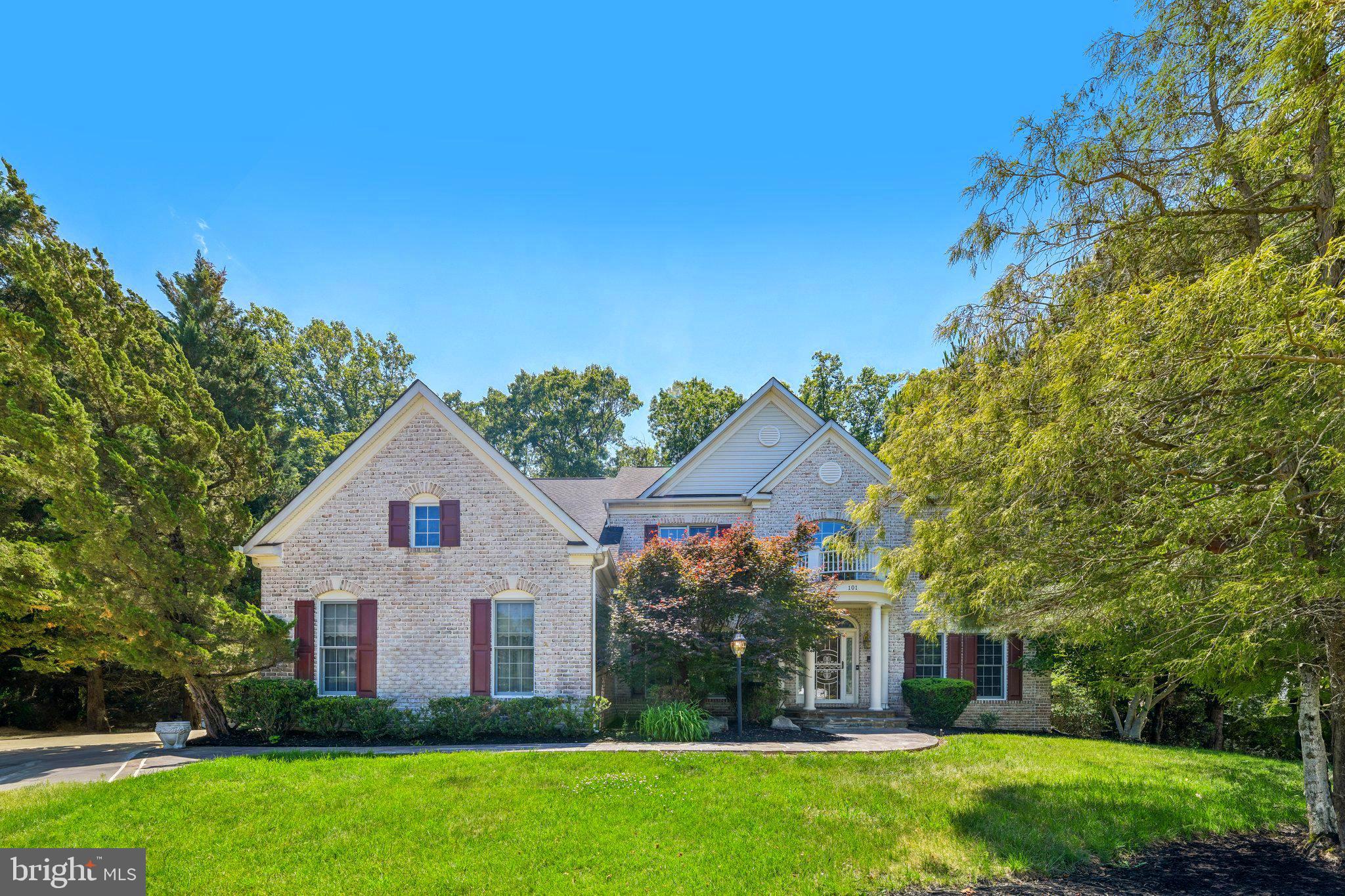 Welcome to 101 Whistling Wood Court. Poised in the gated Farmington Woods enclave, this 6,000+ sq ft custom estate has been freshly updated and meticulously maintained for its next owner. Experience architectural elegance from the moment you enter the two-story foyer, leading to a great room framed by soaring Palladian windows and tranquil forest views.

The gourmet kitchen flows seamlessly to a sprawling deck—perfect for indoor-outdoor hosting. Retreat to a massive primary sanctuary featuring a double-sided fireplace and spa-inspired bath. The fully finished walk-out lower level is a true entertainer’s hub, complete with a custom bar, and library. With recent paint and professional repairs just completed, this home offers timeless craftsmanship and rare value in a prime location minutes from DC and VA.