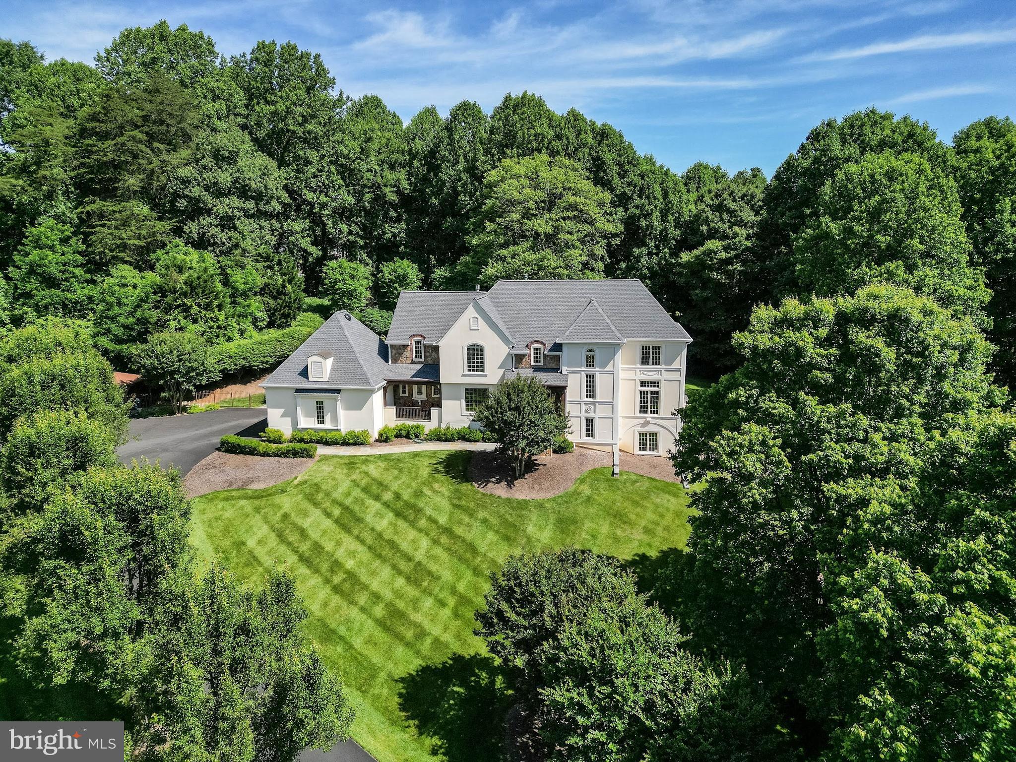 Welcome to this spectacular home, nestled in a private cul-de-sac with a big lot and private pool. Superb location close to Tysons corner and Reston Town center with easy access to Dulles toll road and route 7. This unique and charming home has 5 bedrooms and 4.5 baths. Two-story foyer that features an elegant staircase leading to the second level. The main level all hardwood floors offers a spacious family room with a gas fireplace, large 3 doors that leads to a “resort-like “ private patio and a beautiful pool and spa, perfect for entertaining, outdoor cookouts, relax and enjoy the outdoors. A kitchen with an island, upgraded stainless steel appliances, new washer and dryer, breakfast room with large bay window, large pantry and laundry room, formal dining room, living room and a dedicated office room. AC units/furnaces and water heater are 2 years old. Roof, and 3 gas fireplaces are less than 5 years old! The upper-level features four generously sized bedrooms and three bathrooms. The large owner’s suite has two walk-in closets, and a master bathroom with dual vanities, a jacuzzi tub and a separate shower. The second room has a full bath. The other 2 bedrooms are jack and jill. The fully finished lower level offers a bedroom with a full bathroom, a storage room, a gym room and a large living room that leads to a private newly built patio. 3 door garage with a car lift, makes it fit 4 cars! a large attic and a generator! Also everything you see in the house can be coveyed with the house if buyer wants it!