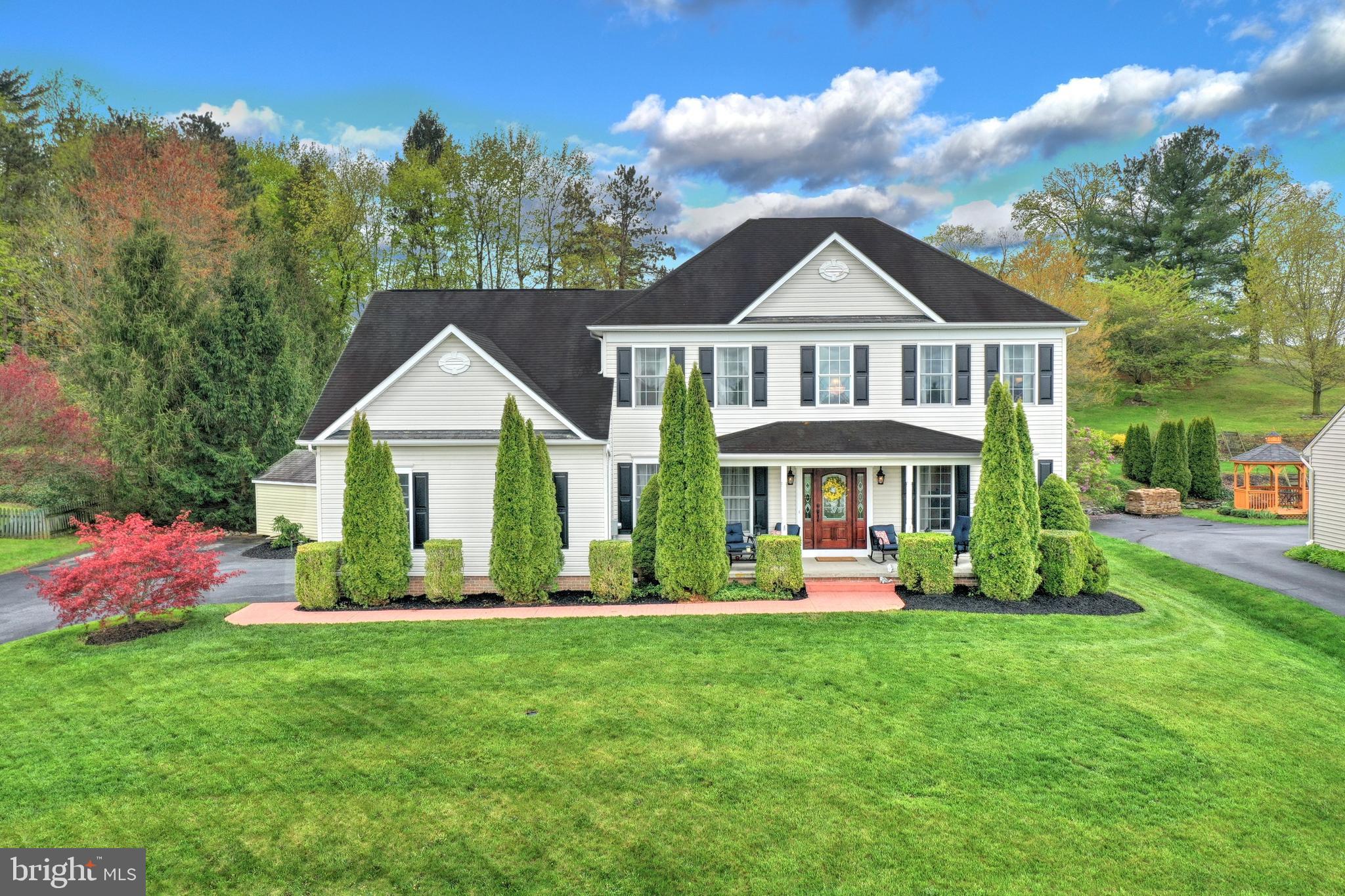 Do you want to have the perfect location, country feel with serene surroundings but easy access to all amenities and close to 83 then look no further.  Close to the rail trail and walking distance to the community park and dog park.   This lovely home tucked away in this gem of a location is well appointed 4 BR 2.5 BA colonial in located in  Colonial Meadows in Glen Rock with desirable open floor plan, offers over  3600 finished living area, with beautiful custom features such as trey ceiling, 9 ft ceilings on first floor, gleaming hardwood floors, crown moldings, large kitchen island, 42 inch cabinets,granite counter tops, farmhouse sink, stainless steel appliances, craftsman finished garage doors, family room perfectly situated off kitchen offering, cathedral ceiling, gas fireplace,  large Palladian windows offering streams of natural light with views of your professionally landscaped backyard with water feature, deck, gazebo, and terraced stone walls.  First floor accommodates your dining needs with an eat in kitchen, pantry, a separate dining room, a well needed first floor home office or retreat,  formal living room, and convenient 1st floor laundry with extra sink and cabinetry finishes off the first floor, second floor offers an owner's suite with trey ceiling, large bath with ceramic tile floors, jacuzzi tub to relax in after a long day, and separate sitting room or extra dressing room, and 3 additional ample bedrooms.   Lower level offers a family room, rough in for half bath for future expansion, and your very own man cave area with special ventilation for smoking, oversized garage and extra parking area in drive, sun-setter awning to enjoy your back deck all day long  finishes off this spectacular home.  If that wasn't enough you can walk through the home with our virtual video walk through:  https://youtu.be/5_ZAXODYAFc