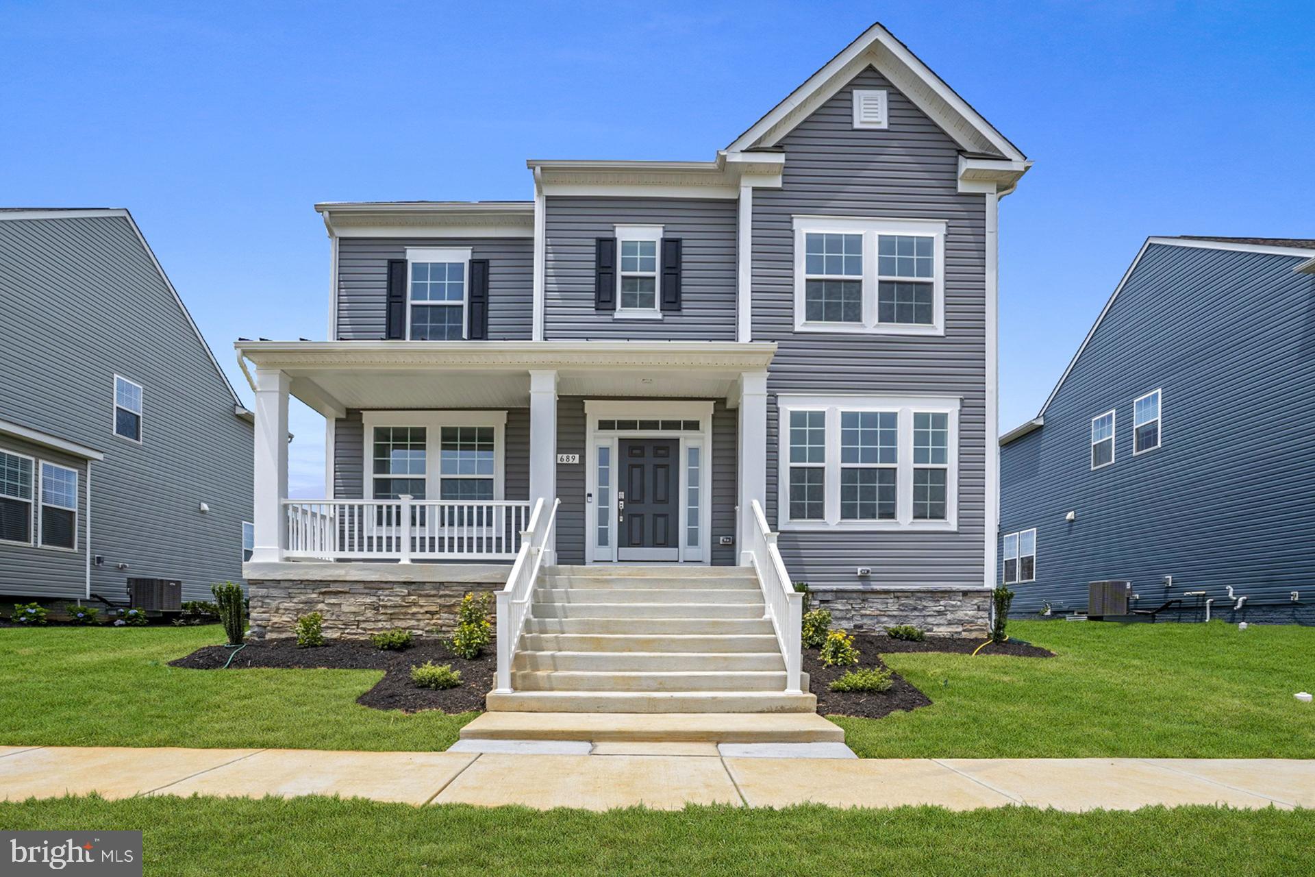 The only community within historic Charles Town with resort style amenities!
**UP TO $20,000 CLOSING COST ASSISTANCE AVAILABLE ON SELECT HOMES, FOR PRIMARY RESIDENCE WITH USE OF APPROVED LENDER AND TITLE!**
MOVE-IN READY! Looking for a home close to historic Charles Town in an amenity rich established community? Meet the Clemson, with its open front porch, black metal roof, impressive pillars, partial stone front, and transom window over front door you will find yourself daydreaming of decorating this space for the holidays. Inside you are greeted with 9 ft. ceiling with crown molding and tall 6 ft. windows on the first floor that allow natural light to fill this open floorplan. In addition to the crown molding the formal dining room and private study have chair rail molding. The private study offers French door entry with glass inset panels. The entire main level features easy to clean durable luxury vinyl plank flooring. Powder room is nicely located between foyer and family room. Walking back to the open family room and kitchen you will see a gas fireplace with mantel featuring an HDMI prewire allowing you to enjoy movie night with a cozy fire. Additional windows in the family room offer a bright open feel. The chef in your home will be delighted with the gourmet kitchen offering gas cooktop, gleaming stainless steel externally vented hood, microwave and convection wall ovens, hidden controls upgraded dishwasher with 3rd rack, and a French Door refrigerator with convenient filtered water and ice dispensing. Wide double door pantry with 5 shelves offers room provides space for an organized, well-stocked kitchen. Warm wood tone full overlay cabinets include 42 in. upper cabinets with crown molding trim. The prep island is over 7 ft. and features a hidden pull-out trashcan/recycling bin and a single bowl stainless undermount sink with in sink garbage disposal. Prep island offers 3 modern black matte and ebony wood-stained pendants that accent the black gooseneck pull down faucet and matte black cabinet knobs. The star of this kitchen is the light Italian quartz countertops with striking marbling and delicate mix of warm and cool shadings offering an elevated aesthetic to this designer palate. White subway tile backsplash is the finishing touch to this luxurious kitchen. The breakfast nook offers a slider exit to a future deck or patio space that could be added to the home. Home offers a convenient 2 car garage behind the home with a mudroom entryway with large closet for coats and shoes and plenty of room to add a drop zone area for backpacks or sports gear. Climb the hardwood stairs to the bedroom level to find a well-appointed primary suite with impressive tray ceiling, massive walk-in closet. Primary bath offers dual sink comfort-height quartz vanity with undermount sinks and ceramic tile walk in shower with frameless glass door and glass corner offer quiet luxury. Secondary bedrooms offer generous closets and feature ceiling light fixture. Laundry is conveniently located on bedroom level and front load washer-dryer is included in this home. Use your imagination to design the unfinished basement to your liking, already included are the 3 piece plumbing rough in and a walkup stair exit to the back yard. This home meets today’s stringent energy code offering 2 x 6 construction with R-21 exterior wall insulation, low profile bright energy efficient LED lighting in the kitchen, family room, foyer, hallways, and basement. Ceiling fan pre-wires are included in all bedrooms and family room. All windows and exterior doors are insulated, and windows feature tilt in lower sills for easy cleaning. Tankless gas hot water heater will also save you money. Enjoy a fully sodded yard with included front landscaping package.