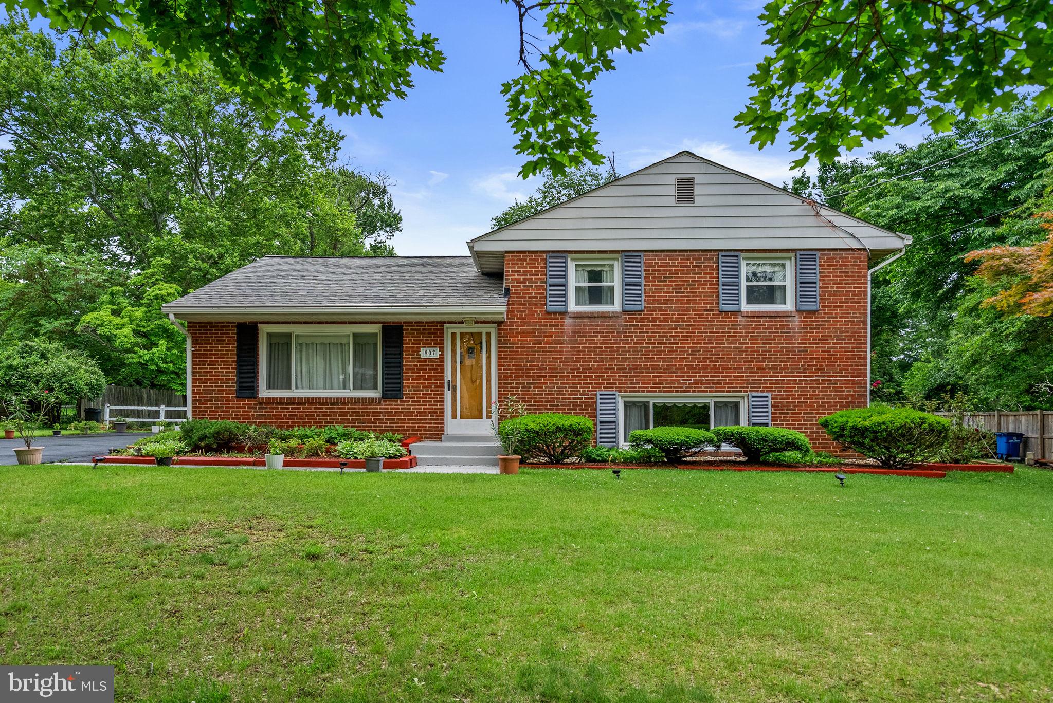 How charming is this meticulously maintained brick, split-level home with a 4-year old roof situated on a quiet cul-de-sac!!! This home's location is a slice of heaven on the most peaceful street, yet close to the conveniently and centrally located ICC, Route 29 and 95   shopping and restaurants are just a stone's throw away. This home is truly a gem and the backyard is the star of the show!
MAIN LEVEL: Upon entering, you will be met by a large living room with a large picture window and wood floors under the carpet. The inviting dining room has chair rail and a lighted ceiling fan. The kitchen is spacious and has pretty wood cabinets, granite counters & backsplash, a double sink; refrigerator with ice maker; built-in microwave, dishwasher, electric stove and a lighted ceiling fan. Off of the kitchen is a family room with walls of windows, ceiling fan and a wonderful view of the gorgeous .56-acre level yard which is truly an oasis and includes a picnic area, a deck perfect of enjoying yard games/nature and two sheds - one is very large workshop! 
UPPER LEVEL: Continuing a half a flight of stairs to the upper level, you will find a full hall bath with a tub and three sizable bedrooms, each with a lighted ceiling fan. 
LOWER LEVEL: The lower level features a great recreation room with plenty of windows and a huge laundry/storage/workshop room with a door leading outside to the side yard. 
UPDATES include dryer 2026; roof 2022; microwave 2020; stove 2017; granite counters/backsplash 2015; dishwasher 2013 and some updates to both full bathrooms. There is also a generator hook-up. 
No homeowner association!