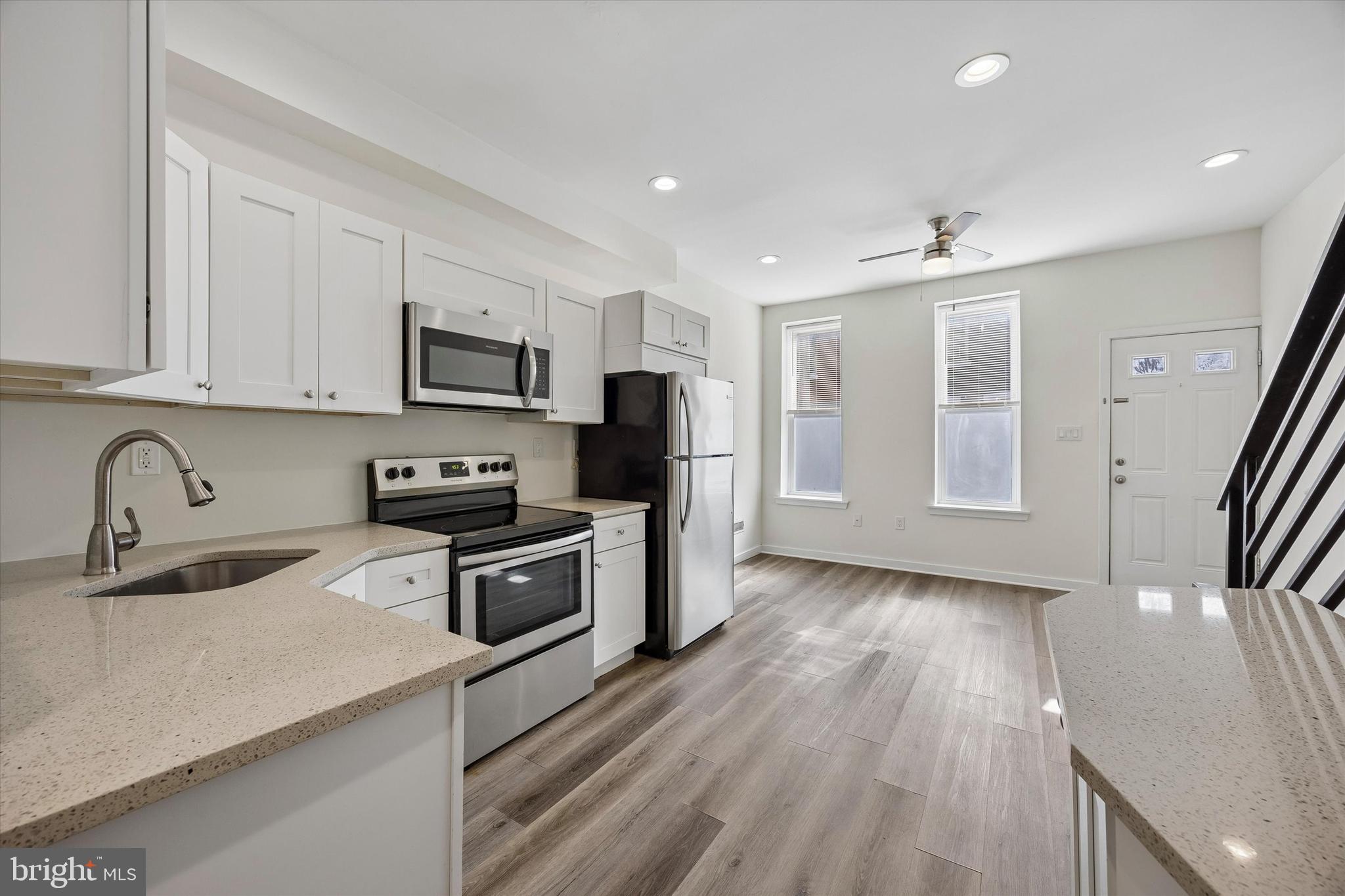 ATTENTION INVESTORS! NOW RENTED AT $1295/MO. Conveniently located, the flexible layout is especially well-suited for roommates, featuring two bedrooms and a hall bathroom on the second floor, plus an additional bedroom and full bathroom on the first floor for added privacy. The home offers modern, sleek finishes throughout, including beautifully tiled bathrooms and a stylish kitchen with white shaker cabinets, granite countertops, and stainless steel appliances. Hard-surface flooring runs throughout—no carpets—making for a clean, low-maintenance investment, all freshly painted and move-in ready. Your tenants will enjoy year-round comfort with central air and ceiling fans, giving them options for staying cool. The finished basement adds valuable bonus space—perfect for a living area, gym, or office—and includes a dedicated laundry area for added convenience. Conveniently located near Temple University’s campus and the Broad Street Line, with easy access to the Susquehanna-Dauphin station.