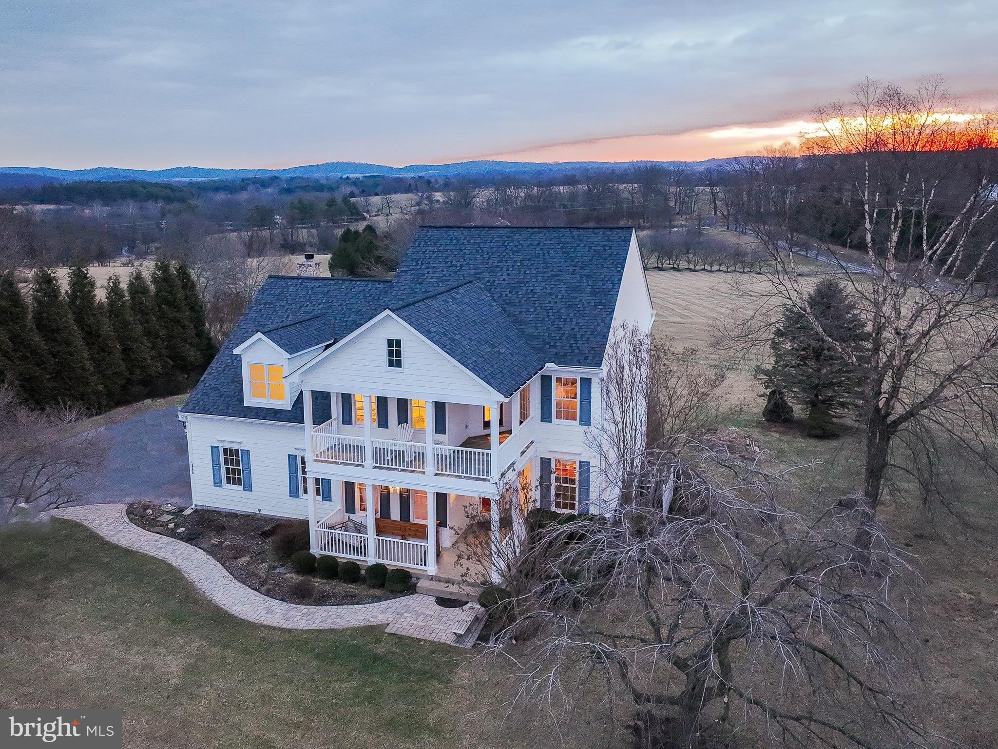 Southern charm awaits!  This exquisite residence boasts a charming two-story porch with a veranda, enhancing the living space in this remarkable home. Perfect for both entertaining and unwinding, it offers breathtaking views of the Catoctin and Short Hill Mountains, where you can savor the beauty of sunrises and sunsets.  Nestled amidst the picturesque vineyards, breweries, and farms of Loudoun County, this property spans 1.01 acres (but the conservancy area behind and the common space to the side make it feel as though you own 6 or 7 acres).  Custom-built by Burke Homes this residence provides 4 bedrooms and 2.5 bathrooms on the 2 levels above grade. The unfinished lower level, with 1460 square feet of space, is equipped with walk-up stairs and rough-in plumbing, allows for an additional bathroom to be added as the new owner desires.   This fine house also has a spacious rear deck (16' x 22') with a dual staircase to the yard for relaxing or entertaining. The 2 car sideload garage is oversized at 23' x 22'.  New neutral colored wall to wall plush carpet installed January 2025 and fresh painting was just completed in February 2025.  Elegant wide plank cherry hardwood floors in Foyer, Dining Room, Living Room, Kitchen, Study, Powder Room, and Main Hallway are complemented by crown molding and oversized trim boards.  Kitchen also has a new suite of stainless-steel appliances.  Located near C&O Canal tow path, the W&OD Trail, Potomac River as well as the Lovettsville Community Center (with horse riding trails, athletic fields, and swimming pool), Waterford’s Greystone community pool is also close at hand, and Franklin Park Arts Center along with Franklin Park Waterpark and Ball Fields.  Within easy reach of the vibrant shopping centers of Purcellville and Leesburg, this home offers a blend of luxury and convenience.   Waterford and the surrounding communities host a variety of wonderful events each year - The Waterford Craft and Arts Fair in the fall and the Loudoun's County Fair in summer and the Loudoun Farm Tours are just a couple favorites.   ** New shower door to be installed before 3/10/2025 - see photos **

Noteworthy Seller Updates and Upgrades -
Hardwood Floors in 2017 -
HVAC (upper system) in 2017 -
HVAC (lower system) in 2021 -
Driveway in 2020 -
Roof in 2021 -
Tankless Water Heater in 2024 -
Wall to Wall Carpet in 2025 -
Interior Painting in 2025 -
Smoke detectors in 2025 -
New Primary Bath Shower Door - to be in by 3/10/25