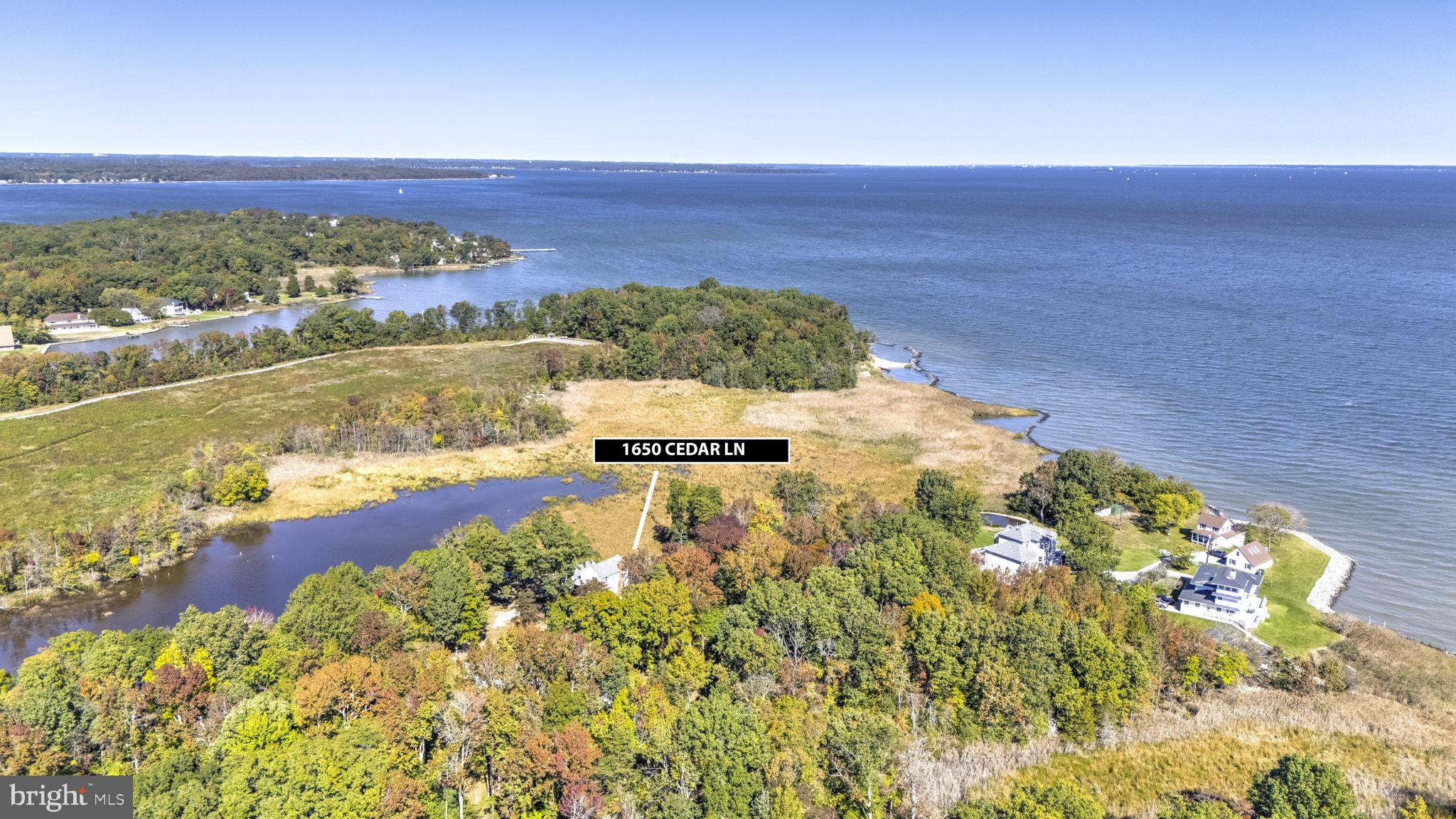 Experience Unmatched Privacy and Tranquility from this unique non-riparian waterfront home set on over 3+ scenic acres. Fall in love with sweeping water views and the serene presence of native wildlife—waterfowl, deer, eagles, and more—all just outside your door. Enjoy panoramic vistas of a natural pond, with the stunning Chesapeake Bay visible in the distance. On clear days, the Bay Bridge is even within sight. The home features a relaxing screened porch, a spacious kitchen that flows into a cozy living area with a wood stove—perfect for chilly evenings. The main level includes a bedroom and full bath, plus an additional room ideal for an office or second living space, also with a wood stove. Upstairs, the primary bedroom offers breathtaking water views, accompanied by another bedroom and a full bath. A barn/stable on the property makes it ideal for horses or a home-based business with office space. This is truly a one-of-a-kind property—peaceful, picturesque, and full of potential. Come see it for yourself.
