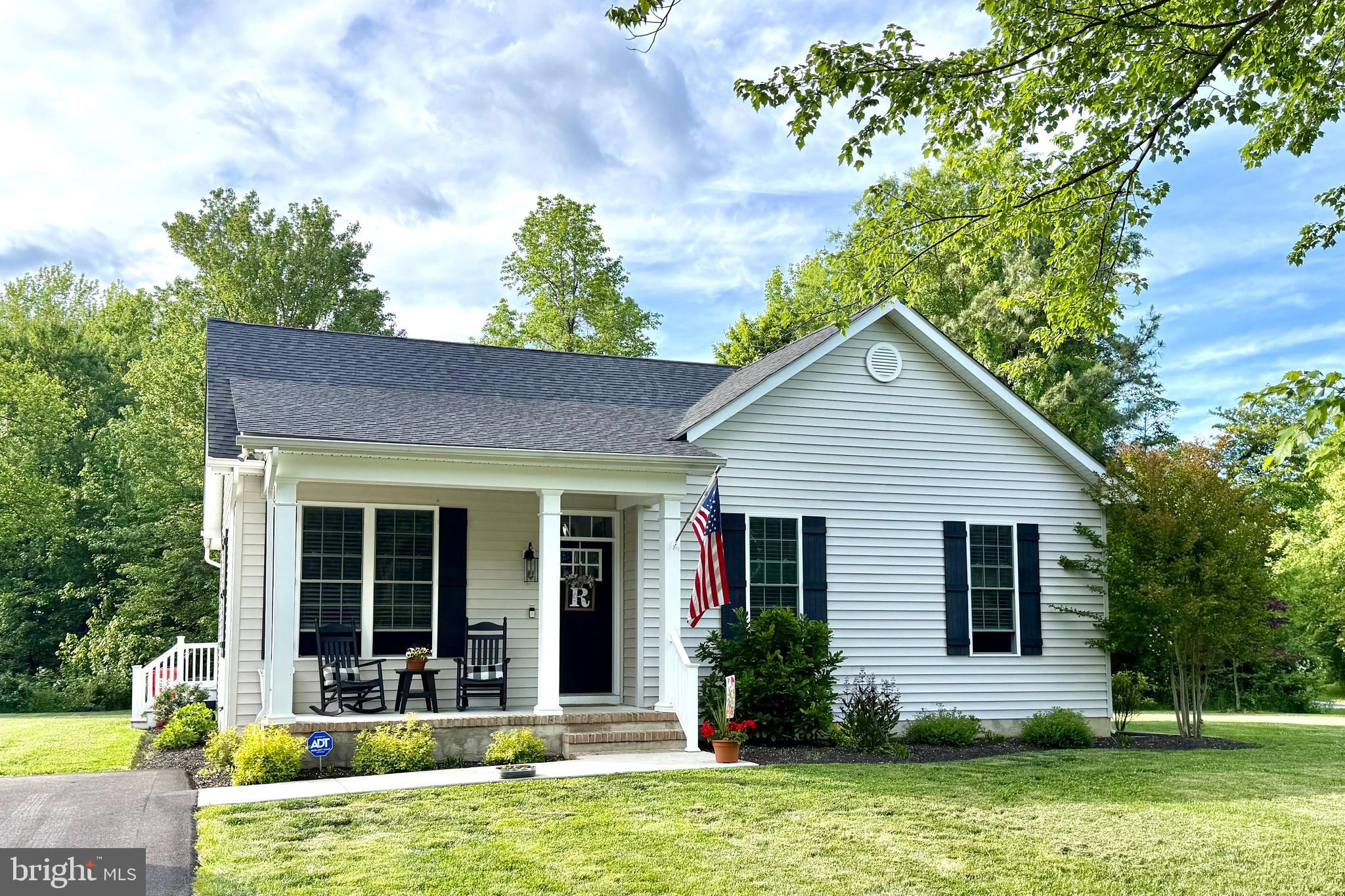 Tucked neatly on a corner in Chesapeake Landing, this three-quarter acre parcel is among one of the largest in the neighborhood. The 2020 custom built home exudes simple luxury. Offering three bedrooms and two full baths in a simple and efficient floorplan, is has flow and comfort in mind. It features a modern kitchen with tall quiet close cabinets, granite counter tops and a tile backsplash, stainless appliances, and an ample pantry for storage. Six-over-six oversized windows throughout the home, extra tall doors, a transom window over the front door, and a ten-foot door to the screen porch allows light to pour inside. A full and separate laundry room remove that chore from the living space and offer a dedicated work room with storage. The Primary Suite includes a generous walk-in closet and en suite bath. Since 2021, upgrades and improvements include: screened porch, Leafguard on all gutters, shed to coordinate with the home’s aesthetics, asphalt driveway, thoughtful landscaping, water treatment system, and is wired for IQ Fiber (formerly ThinkBig) for internet. This home is absolutely, without question, turnkey and ready for its new stewards!