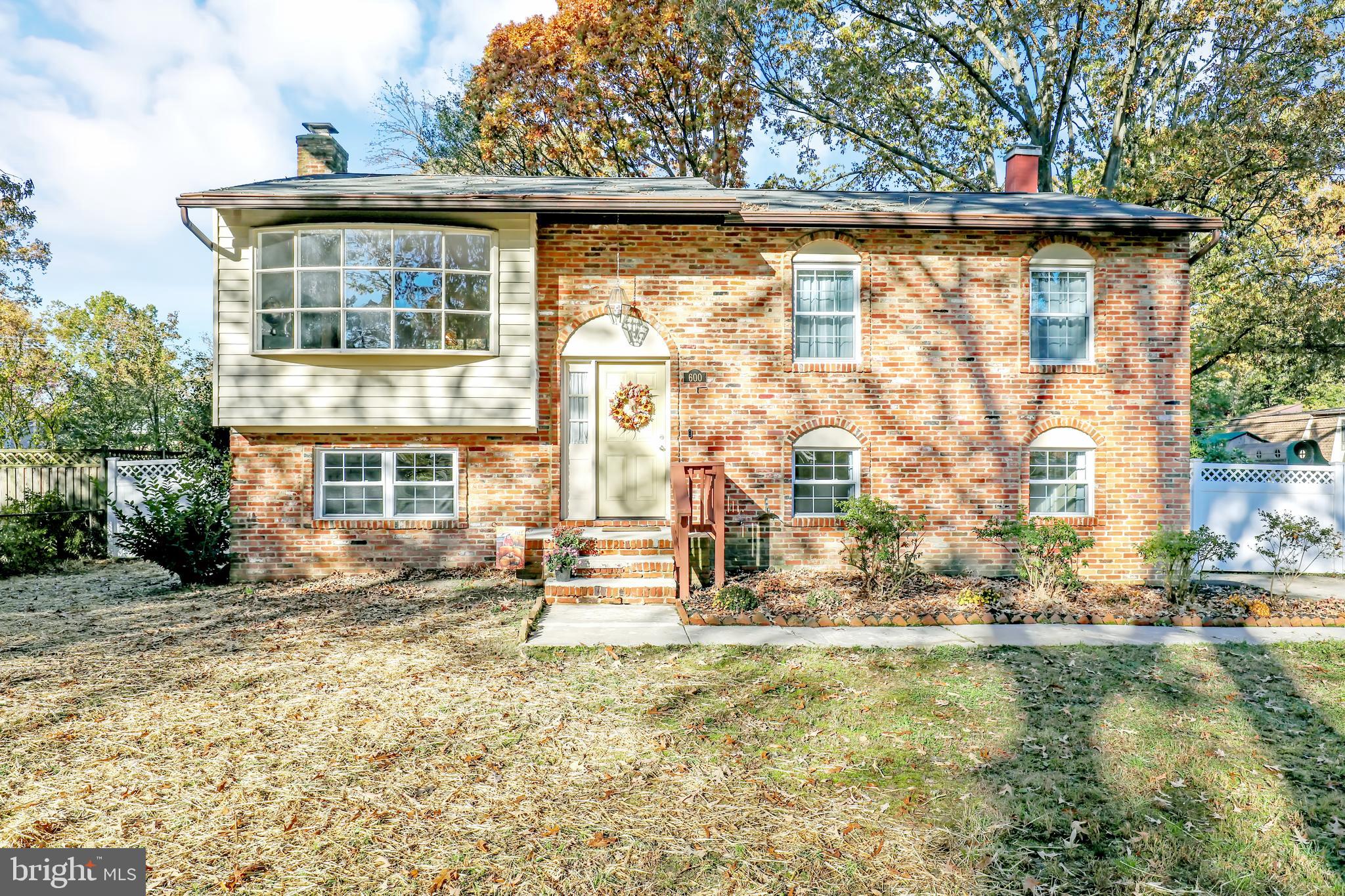 Beautiful home in desirable Carrollton Manor, Severna Park community. Water privileged. Featuring a large corner lot, fully privacy fenced rear yard, driveway for off-street parking, large deck for entertaining and upgraded hardwood floors and granite countertops! Primary bedroom offers private half bath while first floor and lower level both have full bathrooms. First floor bathroom recently completely renovated with beautiful tile work. Open floorplan offers lots of space from kitchen  to dining to living room and the lower level offers a large family room with a walkout level to the fenced-in rear yard. Carrollton Manor features a Clubhouse (coming soon) on East Drive, access to private beaches like Sunset Beach, Crabaway Pier, Hillbottom Beach, and AA Co beaches like Sign Island and Tree Island. Beach access offers kayaking and picnic tables.