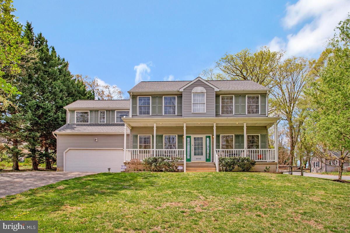 Welcome to 5732 Elkridge Heights Rd – a beautifully maintained Colonial nestled on a no-through street, offering peace, privacy, and a spacious 0.36-acre lot. This 4-bedroom, 2.5-bath home has over 2,000 finished square feet of stylish and functional living space with thoughtful updates throughout.

Step into the impressive two-story foyer, which leads to a formal living and dining room with hardwood flooring. The updated eat-in kitchen features classic shaker-style cabinetry, gas cooking, stainless steel appliances and luxury vinyl plank flooring—perfect for home chefs and entertainers alike. The adjacent family room includes a cozy gas fireplace and is ideal for relaxing evenings.

Upstairs, the spacious primary suite with tray ceiling offers a walk-in closet, soaking tub, and a separate shower. Three additional bedrooms, a full bath, and a versatile bonus/craft room off the 3rd bedroom.

The walk-up lower level is unfinished and ready for your customization. Outside, enjoy a low-maintenance vinyl deck, covered front porch, and a fenced rear yard—perfect for pets, play, and outdoor entertaining.

Additional highlights include a roof replaced in 2019 and no HOA. All while being close to commuter routes, shopping, entertainment and dining.

Don’t miss this turnkey opportunity in a highly desirable location!