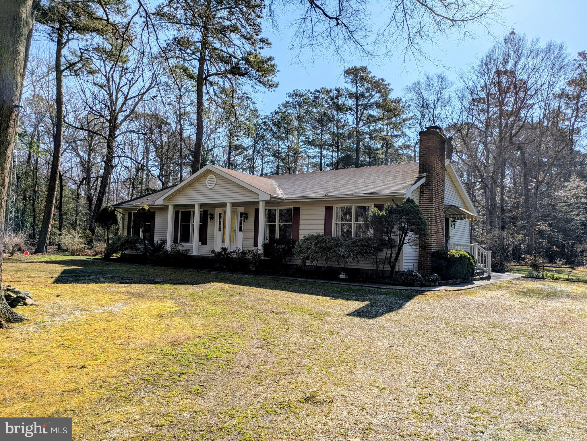 Drive down a country lane surrounded by farmland & woods to the lovely neighborhood of Bantry.  Enjoy your own 5+acres with a circular driveway & scenic surroundings. Welcome to your single level home w/ full front porch, lots of decking & a warm  interior.  Gather around the fireplace or enjoy a window filled great room w/  wood burning stove & access to extensive decking which overlooks the landscaped yard, beautiful gardens  & trees.  Gather around the breakfast counter or sit at the dining room table.  Take refuge in one of the 3 bedrooms, including a primary suite with walk-in closet & in suite full bath.    Laundry room w/ commode, sink built-ins & closet.  Grab your boat, kayak or paddle board & venture down to the community boat ramp & pier.  Or walk or bike down & enjoy the views.  Downtown Easton,  Easton Airport, stores, the new hospital, Rte 50 & the Bay Bridge are just a short ride away.