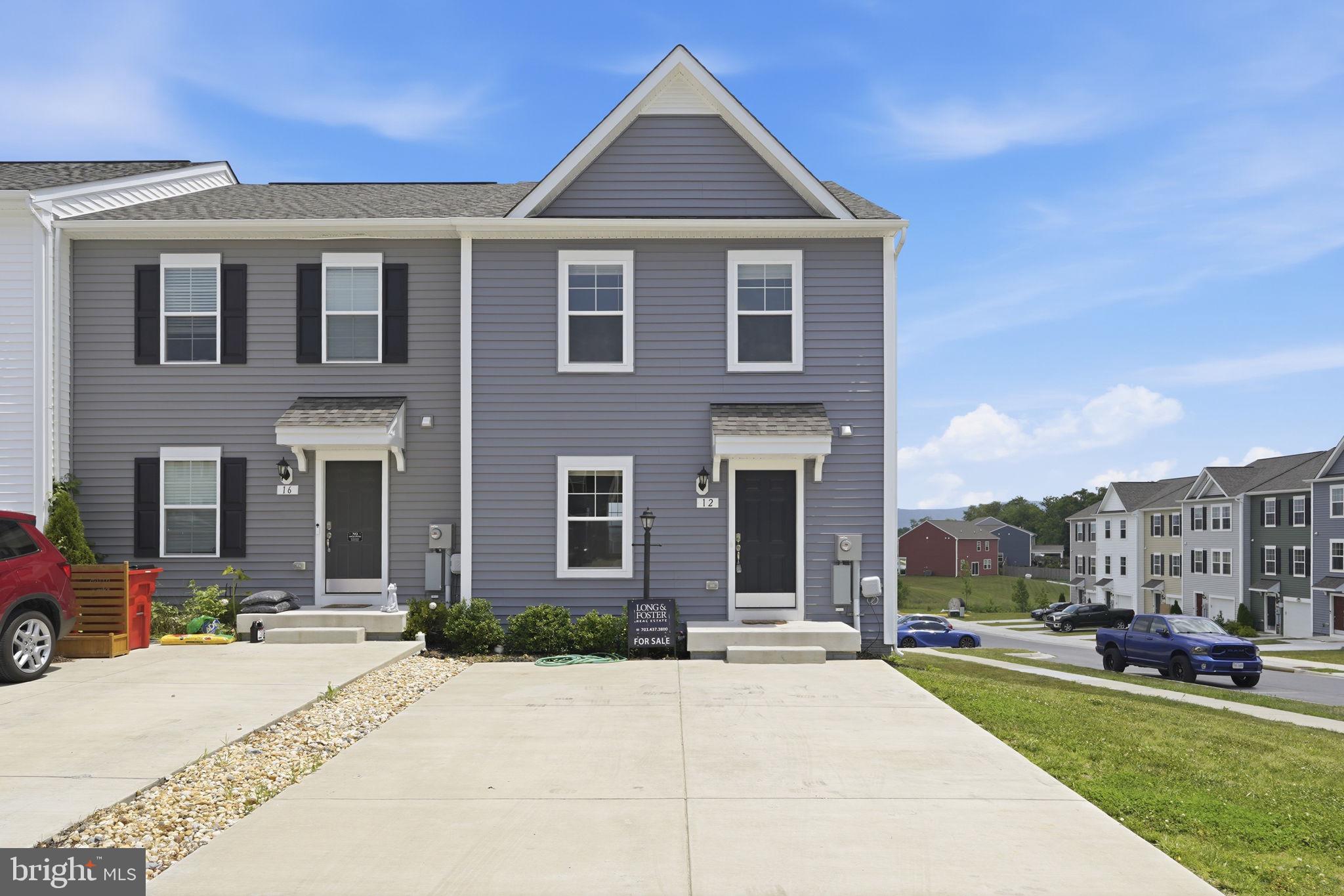 End-unit townhome in the desirable Townes at Tate Manor community offers the perfect blend of modern design and everyday comfort. Built in 2023, this spacious home features 3 bedrooms, 3 full bathrooms, and 1 half bath across a thoughtfully designed floor plan.
The open-concept main level is filled with natural light and provides an ideal setting for both entertaining and daily living. The well-appointed kitchen features stainless steel appliances, ample cabinetry, and a large center island with seating, creating a seamless flow into the adjoining living and dining areas.
The spacious primary suite serves as a private retreat with a walk-in closet and an ensuite bath featuring dual vanities, a soaking tub, and a separate shower. Generously sized secondary bedrooms and multiple full baths offer flexibility for family, guests, or a home office.
Ideally situated near commuter routes to Virginia and Maryland, this home is just minutes from shopping, dining, entertainment, and historic downtown Charles Town. Enjoy the convenience of nearby parks, recreation, and local attractions while living in a newer community designed for today's lifestyle.  Photos coming today