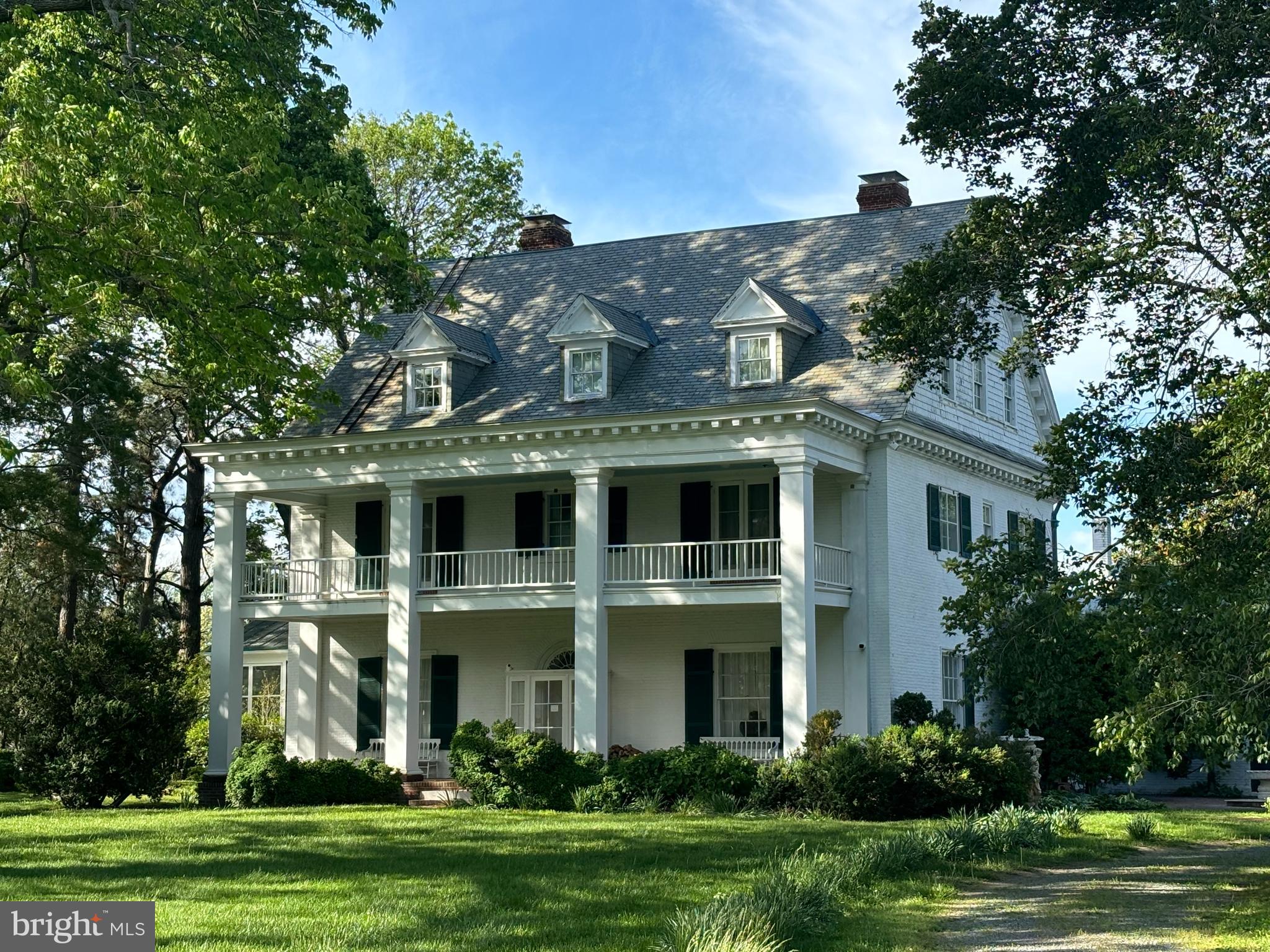 Incredible 300+ acre landmark estate located 5 miles beyond St. Michaels. Over FOUR MILES OF SHORELINE on Eastern Bay, the Miles River and Tilghman Creek. Deep protected anchorage. High land. Sandy beaches. Very livable 10,000+ sq ft home that underwent two-year renovation 2005/2006. 13 ft ceilings on first story and almost10 ft on second story.  Formal and informal living areas. Chef's kitchen with vaulted ceiling and excellent light, stainless steel commercial grade appliances, granite countertops.  Beautiful draperies throughout the house, and gilded valances in LR.  Old wing can serve as caretaker's quarters or home office/conference area or additional BR space. 17 x 16 second story deck off old wing, with outside staircase as well as interior access.  Poolside screened porch 17 x 17 with adjacent brick terrace 12 x 26. Front brick floored open porch 12 x 48 with open porch of same size above.
Elevator accesses all three stories and is designed for a wheelchair use.
Primary bedroom suite has walk-in closets, two large bathrooms, and dressing room with fireplace. 
Bar off FR has built-ins, two wine refrigerators and an ice machine.
Pool 22 x 44 plus apron and brick wall. Pool is long enough for lap swimming. Loop-lock cover is almost new.
HIGH SPEED FIBEROPTIC INTERNET SERVICE is available from Easton Velocity. The line has just been run. Owner has not yet connected.
Close to the amenities of St. Michaels, with shopping, restaurants and Chesapeake Bay Maritime Museum.  
Talbot County has an airport on the northwest edge of Easton. 

2700 sq ft caretaker's/guest house remodeled 2004/2005. 9.5 ft ceilings; 15 x 6 foyer; 17x 12 eat-in K;           
23' x 19' LR with f/p and built in bookcases; 16 ft sq screened porch with great water view;; half bath.; first floor BR 19 x 13 with f/p and en-suite bath;  2d story has 17x 13 BR with fireplace and en-suite bath, 15 x 13 sitting room, 15 x 14 BR. full bath. "B.A.T" (best available technology) septic system new in 2025. Guest house roof less than two years old. Flower cutting beds, vegetable garden and orchard.
Art studio (16 ft square) on high ground close to Tilghman Creek.
Extensive barns and sheds, including  a barn with 5 stalls, tack room and hayloft.
Horse caretaker's apartment near barns. 
Incredible camellias, flowering trees, Spring bulbs.

Rich Neck Manor is Talbot County's earliest land grant (1649/1651), The main block of the house was built for Samuel Harrison ca. 1824, Original pine floors, late Federal paneled doors and surrounds, elegant three-story staircase, mantelpieces, etc. The brick dairy (12 x 22) is an architectural "folly" built by Harrison, now used as a chapel.  Attached to the Harrison house is a ca. 1740 gambrel-roofed brick kitchen (16 x 36) dating to the days of Matthew Tilghman Ward, while the brick smokehouse (20 x 20), and caretaker/guest house date to ca 1790.   Rich Neck Manor was also the home of Revolutionary War patriot Matthew Tilghman.  See attachments for history.
 This property is protected by a land conservation easement and by a MHT historical easement (see documents attached to this listing). The easement holders are helpful with advice and share their knowledge and experience.
Hunting is outstanding on this property and the hunting rights are available to buyer. Fishing is unsurpassed, and the Miles River crabs are said to be the largest, heaviest crabs on the Shore.
WATER DEPTH: the deepwater harbor is on Tilghman Creek. The "dock" is next to the art studio and consists of a bulkheaded and backfilled area with pilings and slips. It is believed that this area was dredged, but the current depth is uncertain. There is an electronic boat lift here. It has been suggested that the new owner should construct a pier perpendicular to the shore, thereby securing very deep water.  The mooring belongs to this property 
Available partly furnished.