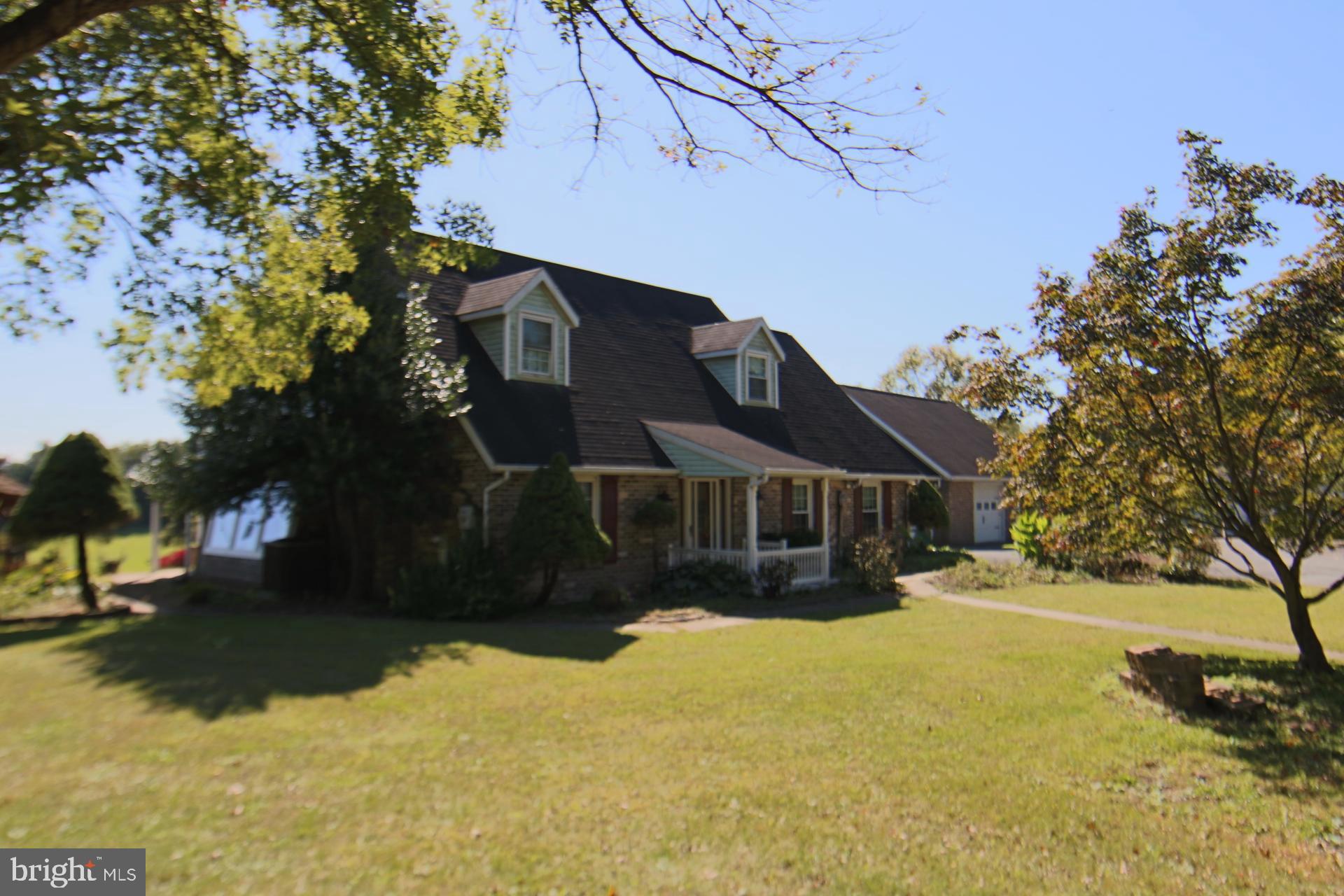 Spacious Cape Cod hidden away on a private 19.19 acres site located in East Hanover Township, Dauphin County that is zoned Commercial Neighborhood. Built 1986, this home offers a first-floor bedroom suite that is handicap accessible, 2.5 baths, large sun room, beautiful rear second floor balcony with a wonderful view and a separate guest/in-law suit located above the attached garages with separate access. Three attached garages, one rear integral garage and a large 48 x 30 detached garage with propane heat and central air conditioning. The value of this property is in the commercial zoned ground and has great upside potential. Purchase it for privacy, mini farm or developing. Fireplace with wood insert, hardwood floors, brick hearth in family room set up to accommodate a free-standing propane stove, water softener, unfinished basement with integral garage.  Property consists of two parcels (25-011-030) and (25-011-085), one parcel is zoned Commercial Highway and the larger parcel is zoned Neighborhood Commercial. Beautiful grounds with small pond, pastures that has been mowed and manicured with lots of fruit trees everywhere. Purchase now for enjoyment or investment. Property is located within minutes of I-81 Hershey-Grantville exit and is within the Lower Dauphin School District. Great piece of real estate. Call for more details.