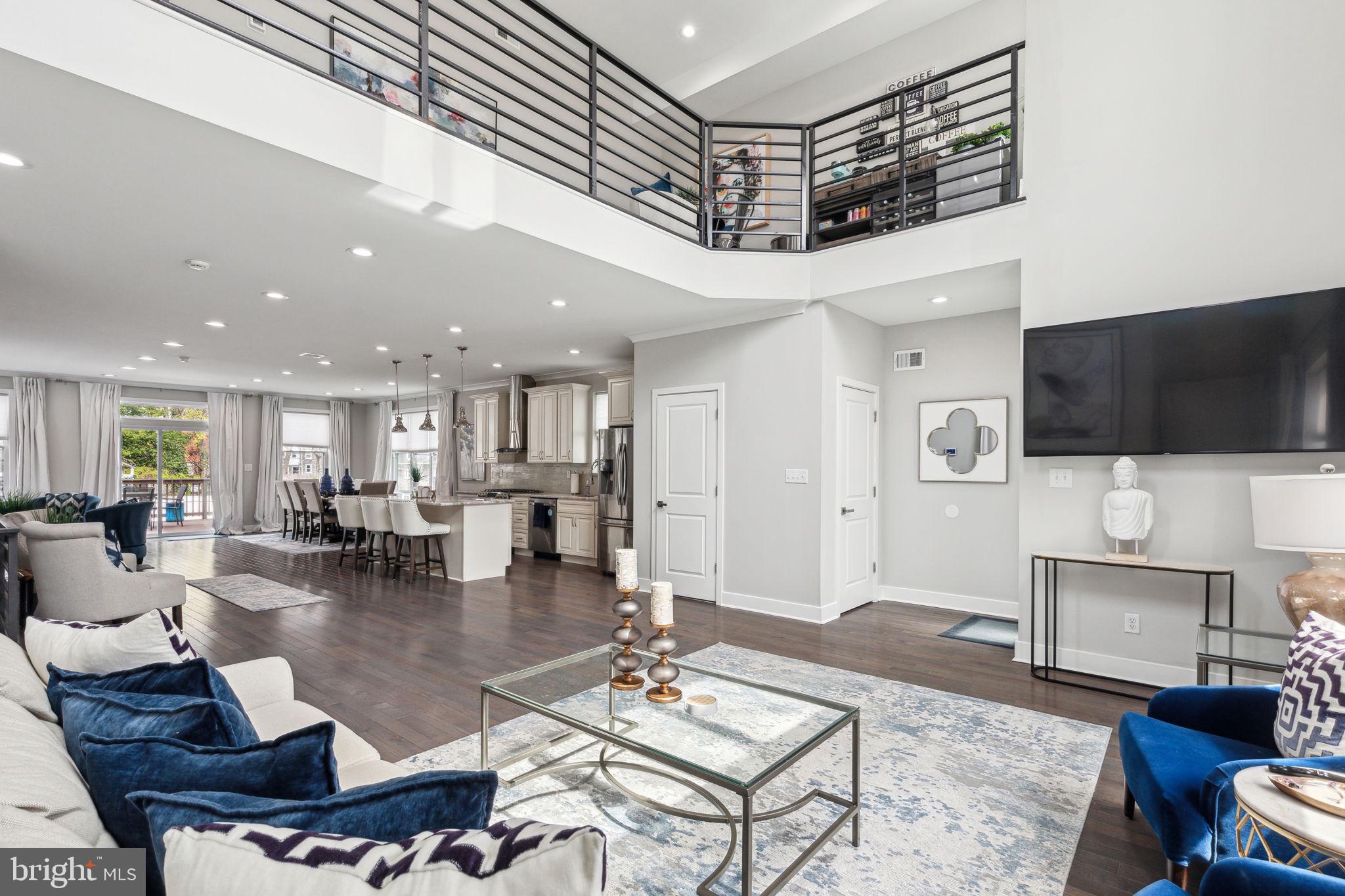 Step into this stunning home and discover a spacious open-concept first floor. The living room features soaring ceilings and oversized front windows that fill the space with natural light. A powder room is conveniently located just off of the living area. The layout flows seamlessly into the chef’s kitchen, outfitted with granite countertops, stainless steel appliances, and a generous amount of cabinetry. Toward the back of the home, there's a dedicated dining area along with an additional seating nook. From here, step directly out to the rear deck — the perfect spot for grilling or relaxing outdoors. The lush yard features a cozy seating area surrounding a built-in gas fire pit — the ideal space to gather on cool evenings.
On the second floor, a lofted lounge offers a versatile hangout space. The hallway includes a laundry area for added convenience. The luxurious primary suite features two expansive closets and large windows that bring in tons of natural light. The en suite bathroom includes a double vanity, soaking tub, and a spacious walk-in shower.
The third floor includes four well-sized bedrooms, each with ample closet space. The two middle bedrooms share a Jack-and-Jill bathroom with a double vanity and a large linen closet. An additional full hallway bath completes the level.
At the base of the stairs to the roof deck, a sleek wet bar makes entertaining easy. Upstairs, the rooftop offers city skyline views and plenty of room to relax or host guests.
The fully finished basement provides extra living space and interior access to the two-car garage, which includes two sizable storage closets.
Located near Fairmount Park, St Joseph’s University, and with easy access to public transportation and the interstate, you don’t want to miss this one. Schedule your tour today!