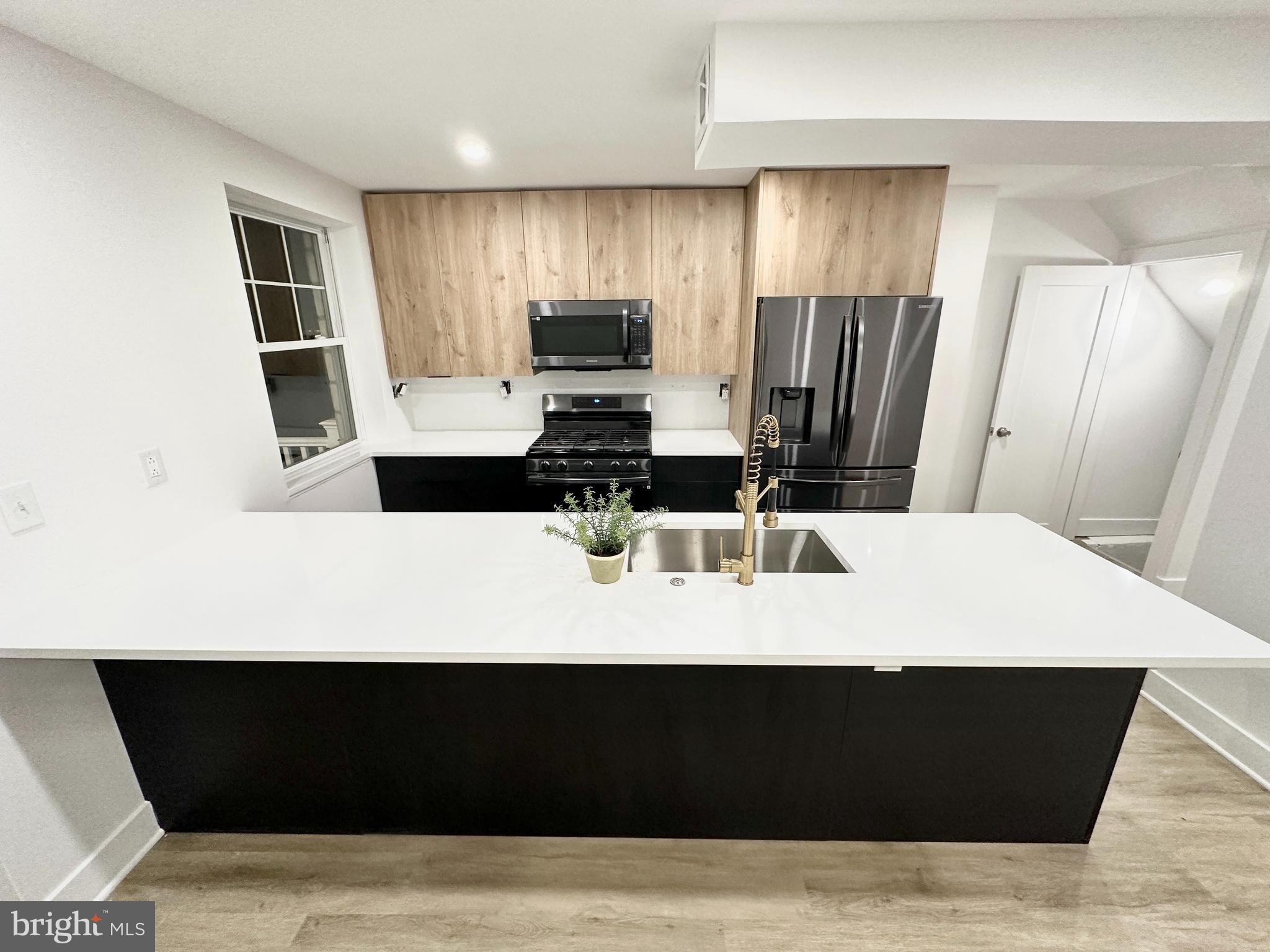 Charming 3-Bedroom Modern Home with Double Fireplaces and Expansive Rear Yard
**Description:**
Step into this charming, modern home, where comfort meets elegance in a seamless blend. Offering three generously-sized bedrooms and two full baths, this property is perfect for families and those who appreciate extra space.

A welcoming living room awaits you, complete with a cozy modern fireplace to add warmth to any gathering. The open layout allows for smooth interaction between the living room and other spaces, ensuring that each moment spent here is one of connection and togetherness.
The kitchen, designed with functionality in mind, is ready to cater to all your culinary adventures. Its strategic placement next to the dining area makes serving meals a breeze, 
The finished basement comes with its own fireplace, providing an ideal setting for a family game night, a tranquil reading spot, or a personal gym. The choice is yours!

Outside, you'll find a spacious deck overlooking a huge rear yard, ready to host summer parties, BBQs, or simply to provide a serene spot for your morning coffee. The expansive lawn offers a world of possibilities, from gardening to creating your own outdoor haven.

Parking is never a concern with the ample space available.

This home truly checks all the boxes for modern, comfortable living. Don't miss out on this treasure. Schedule your viewing today and start creating memories in your new home.
Complete renovation , with new heating , hvac, central air

(  Basement can be used as an additional bedroom )
