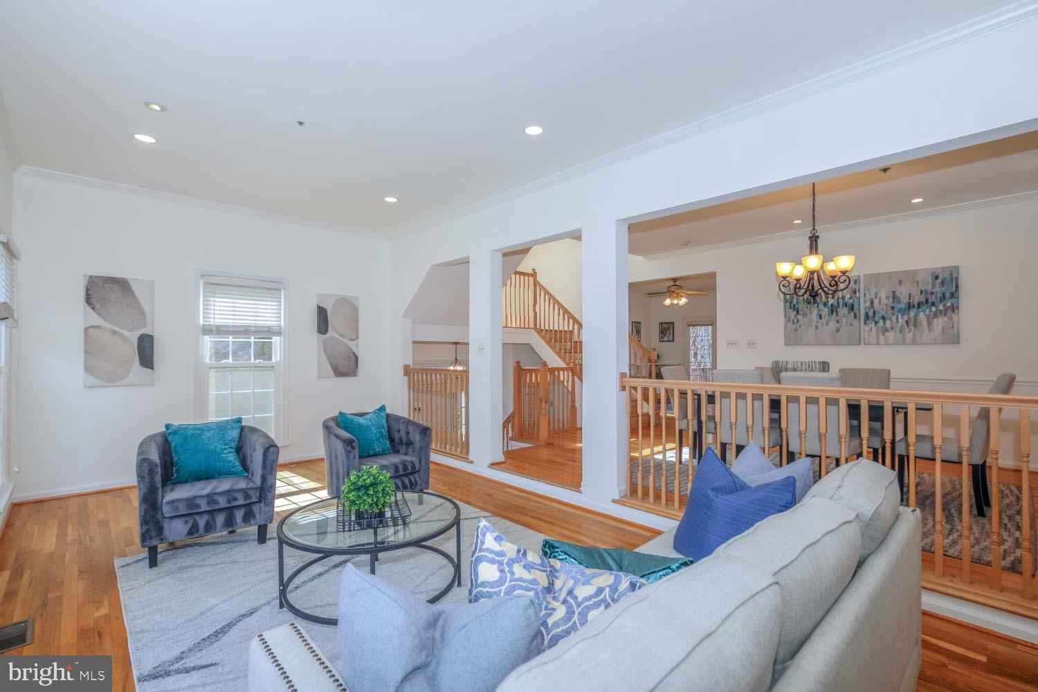 Welcome to 1709 Leighton Wood Lane—a sun-filled, end-unit townhome in Silver Spring’s highly desirable Woodside community. Offering over 3,000 square feet of beautifully maintained living space across four finished levels, this home combines comfort, flexibility, and unbeatable location.

Walk to the Metro and vibrant Downtown Silver Spring, where you’ll find restaurants, shops, parks, and entertainment at your fingertips. Nestled on a premium lot backing to trees and lush landscaping, this home offers a rare balance of suburban privacy and city convenience.

The main level welcomes you with hardwood floors and a spacious open layout. A formal living and dining area flows seamlessly into a cozy family room and an updated eat-in kitchen featuring granite countertops, stainless steel appliances, and ample prep space—ideal for everyday living and entertaining. Step outside to the private fenced yard and composite deck—a peaceful retreat perfect for al fresco dining and gardening.

Upstairs, the lofted primary suite serves as a private sanctuary, complete with vaulted ceilings, custom closets, and a large en-suite bath with a huge soaking tub. Two additional bedrooms and a second full bath provide ample space for family, guests, or a dedicated home office. 

The fully finished walk-out lower level expands your living options with a cozy fireplace and another space for a play area or homework nook, a second half bath, and direct backyard access. 

Notable updates and upgrades include a roof in (2019), composite deck (2020), new windows in (2017), and two gas fireplaces. Hardwood flooring throughout the upper levels features, adding warmth and distinction. Additional touches like custom Hunter Douglas shades, designer light fixtures, and abundant natural light enhance the home's inviting atmosphere.

Parking is a breeze with a 2-car attached garage, and 2-car driveway—a rare combination in this location. The community’s low monthly HOA includes lawn and road maintenance for added ease.

With space to grow, thoughtful upgrades, and walkable access to everything Silver Spring has to offer, If you're looking for a lifestyle upgrade don't pass on this rarely available gem.
