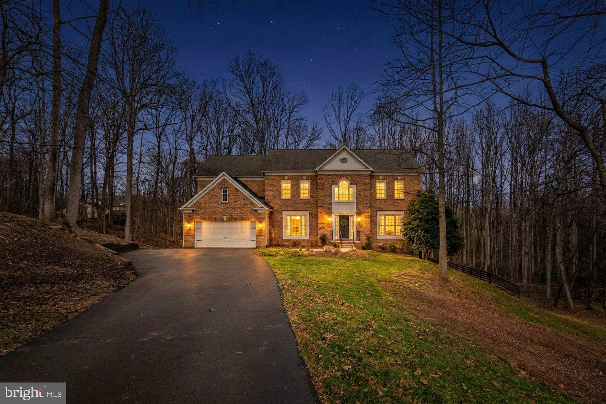 Exceptional colonial home in the Fairwinds community in Oakton. Boasting three thoughtfully finished levels and 4,140 finished square feet of refined living space, this contemporary home offers 5 bedrooms and 4.5 bathrooms, set on a 1.12-acre lot. A welcoming foyer invites you and guests inside, setting a sophisticated tone for the home’s interior with marble floors and views of the quiet sitting room as you enter. Designed for both easy living and exciting entertaining, the main level features a formal dining room, family room, living room, and home office. The family room is perfect for large gatherings, with a wood-burning fireplace that adds a true homey touch to the space. Thoughtful details and features are seen throughout the main level, including vaulted ceilings, crown moldings, and large windows that fill the home with natural light. The gourmet kitchen is a chef’s and entertainer’s dream, featuring granite countertops, ample countertop space, stainless steel appliances, and bar seating. The kitchen includes enough space for a kitchen table and leads to a new screened porch, perfect for enjoying your morning tea or coffee in all seasons. All of the windows on the home allow for great views of the wooded areas beyond the home, making the home feel private and tucked away. On the upper level, the large owner’s suite serves as a private retreat, with an impressive attached ensuite, two large walk-in closets, and a small sitting room, all part of the primary suite. Three additional generously sized bedrooms complete the upper level, one with an attached ensuite and two bedrooms connected with a Jack-and-Jill bathroom. The final bedroom is on the lower level and includes a full attached bathroom. Also on the lower level is a large walk-out recreation room with ample storage space. The outdoor living opportunities are endless with the brand new screened porch and deck, perfect for grilling and large gatherings. A two-car garage and a spacious driveway offer ample parking for both you and your guests. Short drive to shops, restaurants at Reston Town Center, in Oakton, Vienna, and Fair Oaks. Nearby Waples Mill, Franklin, and Oakton pyramid.