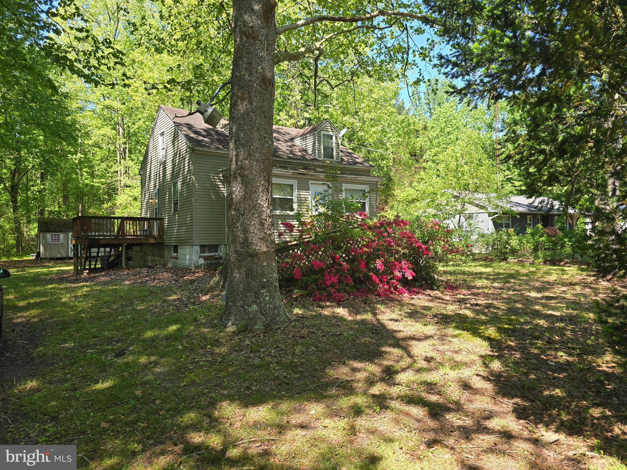 Discover a hidden gem with immense potential nestled on a sprawling 9.7-acre lot. This cottage-style home offers 1304 square feet of versatile living space, featuring three bedrooms and a full bath with tub shower, ideal for creating a cozy retreat. The kitchen, equipped with custom-made wood cabinets, appliances and an island, is a delightful hub for culinary creativity. The wood, vinyl and carpet floors, enhances the home's warmth atmosphere. The unfinished basement offers endless possibilities for expansion or additional storage, while the expansive rear yard, bordered by trees, provides a serene backdrop for outdoor activities or future development. With road frontage and a private setting, this property presents a unique opportunity for those looking to capitalize on land value and potential appreciation. The tranquil wooded views and proximity to nature create an appealing environment that attracts buyers and investors alike. Don't miss this opportunity to invest in a property that combine space and potential returns. NOTE - This listing is made up of three parcels ID # 16-001090, 16-002143, 16-002151.
