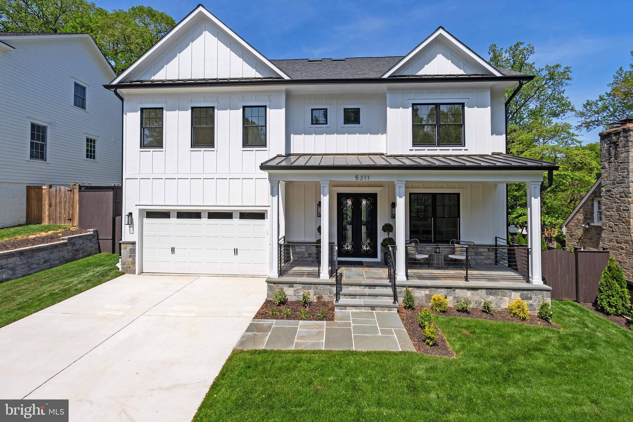Welcome to 5311 Blackistone Road, an exquisite residence in the heart of Westmoreland Hills, where elegance meets modern sophistication. This newly constructed masterpiece, built in 2025 by a boutique builder who spares no expense, offers a spacious 5,900 square feet of luxurious living space, featuring 6 bedrooms and 6.5 bathrooms.

Step inside through custom 8 foot wrought iron doors to discover a home adorned with 6-inch white oak flooring and designer lighting throughout. The chef's kitchen is a culinary dream, equipped with Viking brand stainless steel appliances, designer hardware and custom cabinetry.  The main level boasts 10-foot ceilings and a seamless flow into the living areas, accentuated by a stunning linear gas fireplaces and intricate moldings including a coffered ceiling in the family room.

The generously wide staircase takes up to the second level with a primary suite and three additional bedrooms all with ensuite baths.  The primary suite is a sanctuary of comfort with a lighted tray ceiling, two walk-in closets, and an opulent ensuite bath featuring a soaking tub, separate shower, and Grohe fixtures. All closets are built-out with wooden rods and shelving. Each en-suite bath has its own unique character with carefully selected tiles and fixtures.
 
The third level boasts another gathering space, a full bath and bedroom, all flooded with natural light and views for miles.  Peer down the stairwell all the way to the main level – an elevator to access all floors can be easily installed if desired. 
 
The finished lower level is an entertainer's dream, boasting an almost 10 foot ceiling height, complete with a gym, second kitchen, wine room, bedroom, and full bath. Enjoy effortless indoor-outdoor living with a walk-out to the back patio, paved with elegant blue flagstones.

Completing this exceptional offering is a two-car garage with a fast EV charger, ensuring convenience and sustainability in one.

The fully fenced and professionally landscaped backyard is ideal for garden parties. Entertain with ease with the flagstone patio just off the kitchen and family room. Close proximity to The Little Falls Trail, Capital Crescent Trail, Westmoreland Hills Park and the neighborhood meeting place; "The Little House”. This spectacular residence offers tranquil living while being close to Spring Valley, Friendship Heights and Westbard Square shopping districts, the Metro, downtown DC, and Bethesda.  Westbrook ES, Westland MS, and B-CC HS serve the neighborhood. Discover refined living at its finest, welcome home!