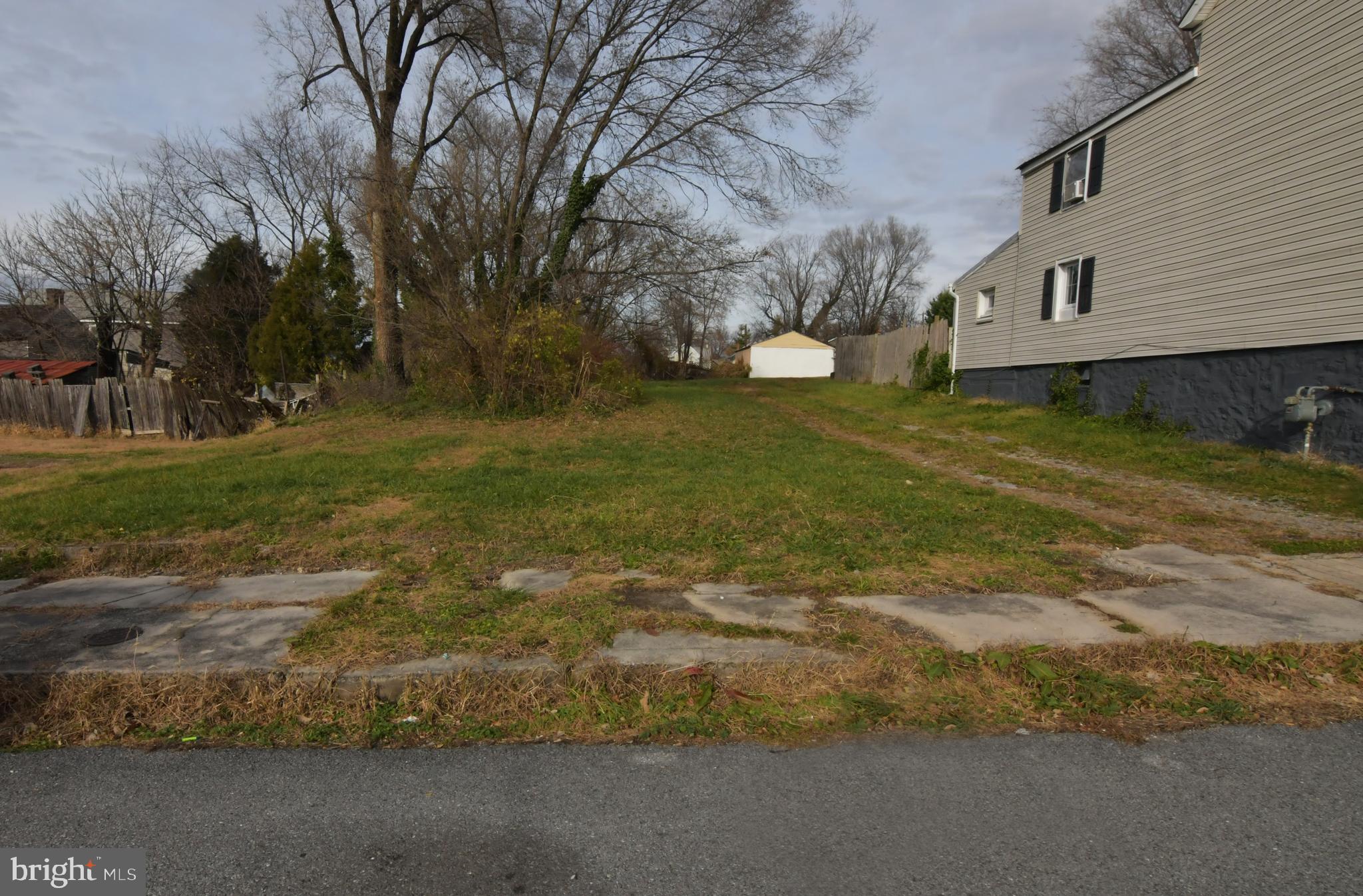 EASILY AFFORDABLE! Near downtown Martinsburg and convenient to I-81. Lot size 0.20 acre. Mostly level.  Sold strictly as-is, where is. Cash only. Buyer to verify water and sewer availability and whether lot is suitable for buyer's intended use.  Per the City of Martinsburg, water and sewer are available to serve the property. May be subject to tap fees. Also, may be subject to new impact fees for houses, multi-family and mobile homes that must be paid before a building permit is issued.  The Eastern Panhandle is one of the fastest growing areas of West Virginia.  Residents of Martinsburg and Berkeley County are attracted to the small-town atmosphere, employment opportunities, restaurants, shopping, services, medical facilities, a revitalizing downtown, and access to major roads, the MARC train and Amtrack. Lot size approximate. Cash only - proof of funds required.