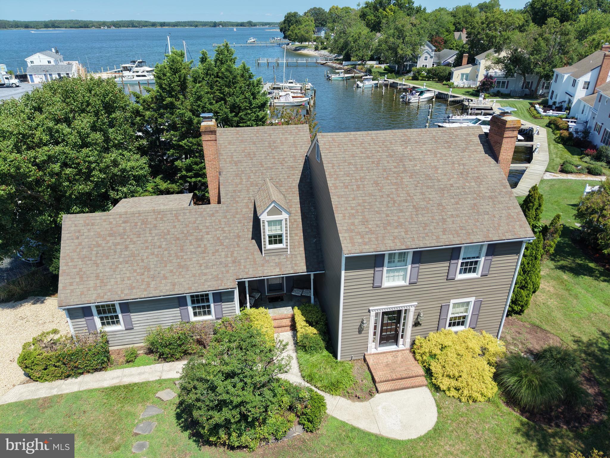 Waterfront, a deeded boat slip, off-street parking, and a single-car garage with additional storage set the stage for this thoughtfully redesigned coastal retreat in the heart of Oxford. Completely renovated from top to bottom, this 3 bedroom, 2.5 bathroom home blends timeless Eastern Shore charm with luxury finishes and exceptional boating amenities.

Every detail has been carefully curated, from the new hardwood flooring and fresh paint throughout to the completely remodeled gourmet kitchen featuring high-end appliances, quartz and soapstone countertops, custom cabinetry, and a butler's pantry connecting the kitchen and dining room. The dining room is anchored by a beautiful masonry fireplace with a gas insert, while the custom "Wine Snug" offers built-in wine racks, a wine refrigerator, and handcrafted wrought iron doors.

Designed to maximize its setting, the home captures water views from both the front and rear, with sightlines straight through the home to the water. Upstairs, the primary suite opens to a private balcony overlooking the harbor, and the conveniently located second-floor laundry adds everyday functionality.

For boating enthusiasts, the property includes a deeded 40’ boat slip accommodating with approximately 5’ MLW.

Ideally located just moments from downtown Oxford, you'll enjoy easy access to marinas, the Oxford Ferry, waterfront parks, and local favorites like Doc's Sunset Grille with frequent live music. Whether you're searching for a full-time residence, weekend getaway, or luxury second home, 100 W. Pier Street offers the perfect blend of water views, boating access, modern updates, and the relaxed Eastern Shore lifestyle.