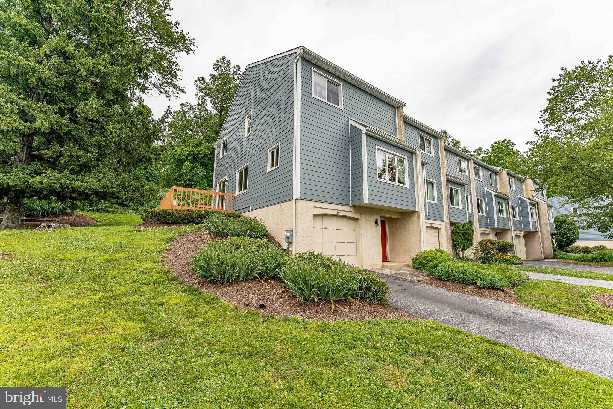 Welcome to 301 S Point Drive, a 2-bedroom, 2.5-bathroom townhouse in the desirable South Point community of Chadds Ford. Offering a functional multi-level layout, thoughtful updates, and low-maintenance living, this home combines comfort and convenience in a prime location. As you approach the home, you'll appreciate the private 1-car garage and driveway parking. Inside, the entry-level foyer features tile flooring and provides direct access to the garage. This level also includes a storage and utility room, offering excellent space for organization and additional storage needs. Upstairs, the main living level is designed for both everyday living and entertaining. The inviting living room features carpet flooring, a ceiling fan, built-in speakers, and a cozy fireplace that serves as the focal point of the space. Sliding glass doors lead to the private deck, providing the perfect spot to enjoy your morning coffee or unwind after a long day. The kitchen showcases beautiful Tigerwood hardwood flooring, granite countertops, a peninsula, stainless steel appliances, and ample cabinetry. Adjacent to the kitchen, the bright breakfast area continues the Tigerwood flooring and features a ceiling fan and large triple window that fills the space with natural light. A conveniently located powder room with tile flooring completes this level. The upper level is home to the spacious primary suite, featuring carpet flooring, a ceiling fan, and two closets for ample storage. The en-suite bathroom includes tile flooring and a step-in shower. The second bedroom offers carpet flooring, a ceiling fan, and a walk-in closet, making it ideal for guests, family members, or a home office. A full hall bathroom with tile flooring and a tub/shower combination serves this bedroom, while a laundry closet conveniently located in the hallway completes the upper level. The South Point COA provides lawn, road and exterior building maintenance, snow removal, and trash service, allowing for easy, low-maintenance living. Ideally situated just off Baltimore Pike, this home offers convenient access to local shopping, grocery stores, restaurants, entertainment, and more. Don't miss the opportunity to make 301 S Point Drive your new home.