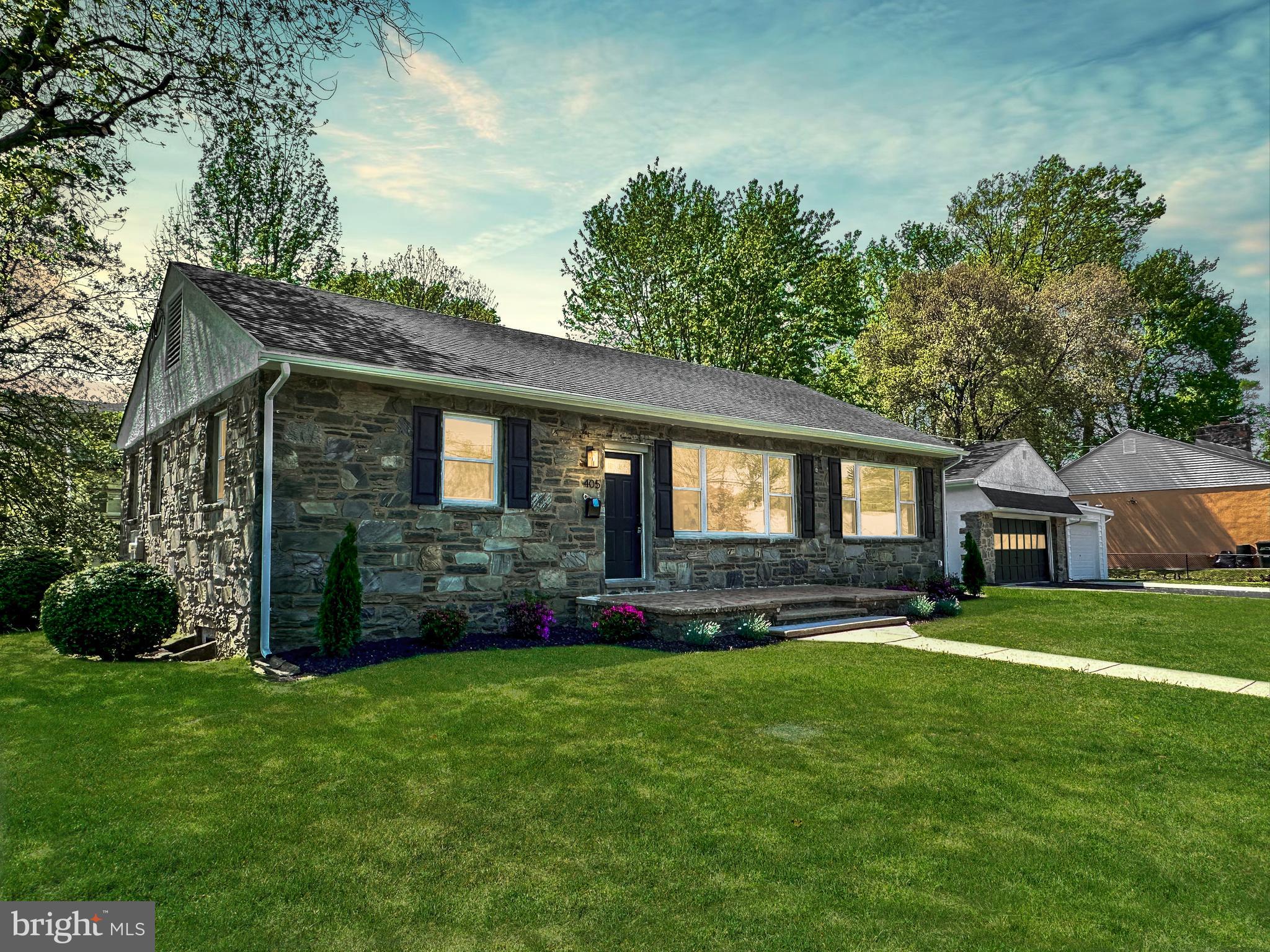 Welcome to 405 Brighton Terrace, an impeccably remodeled stone residence set on a corner homesite in desirable Ridley Township. Offering the ease of one-level living, this 3-bedroom, 2-bath property seamlessly blends classic architecture with refined, modern updates throughout. Step inside to a sunlit, open-concept layout enhanced by expansive windows and stylish new finishes. At the heart of the home is a stunning gourmet kitchen featuring a generous island, gleaming quartz countertops, stainless steel appliances, and custom cabinetry — ideal for both everyday living and entertaining. The finished lower level provides exceptional flexibility, complete with a beautifully tiled full bath, perfect for a guest suite, home office, or additional living area. Additional highlights include an oversized two-car garage, all-new flooring, and upgraded HVAC, plumbing, and electrical systems for turnkey low maintenance living for years to come. Perfectly located just 20 minutes from Center City Philadelphia and 10 minutes to Philadelphia International Airport, with easy access to I-95, I-476, local parks, shopping, and dining. Situated within the highly regarded Ridley School District, this exceptional property offers both elegance and convenience in one of Delaware County’s most sought-after communities.