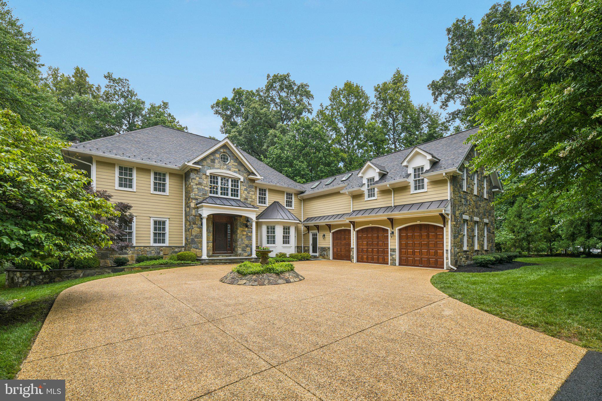 Beautiful custom-designed home situated on a picturesque, park-like setting with approximately 6,300 finished square feet of living space.  This award winning renovation sits on a heavily wooded nearly two acres lot on a cul-de-sac.    Modern bathrooms and fully updated kitchen with new appliances.   Large three season screened in porch with a TV.   James Hardie siding, complemented by stone water tables, a stone accent wall and detailed trim work that gives the home a timeless and refined appearance.  To further enhance the front elevation, a new portico was added, along with seam metal overhangs above the garage doors, introducing subtle modern accents that balance beautifully with the homes classic character.  In the backyard, the outdoor living experience was completely reimagined.  A spacious screened porch was added to provide comfortable, protected space for relaxing and entertaining throughout the seasons.  Adjacent to the porch, the existing deck was transformed and expanded, creating a cohesive outdoor gathering area that connects seamlessly to the home.  Additional access points from the house were incorporated to improve flow between indoor and outdoor spaces, making hosting and everyday living more convenient. 

The remodel also included widening the lower rear entrance, improving accessibility while enhancing the overall functionality of the backyard layout.  Together these thoughtful architectural upgrades and outdoor living improvements created a cohesive design that elevates both the curb appeal and the way the owners enjoy their home.  

Billiards room with mini bar.  New roof, full house backup generator and irrigation system.   Stone fire pit and private outdoor setting.  The main level has beautiful wide plank hardwood floors that were installed in 2022.  The center of the home has a gourmet kitchen with a center island, designer cabinetry and a separate dining room. The family room welcomes you with abundant natural light.  Open the French doors to a beautiful deck stone grilling area.  The upper level overlooking the grand 2 story entry features four bedrooms including an amazing primary suite with a spa like primary bathroom. The lower level is fully finished and offers a fifth bedroom along with a workout area.  Outside enjoy your own private oasis with a tree lined backyard, fire pit, patio and professionally designed landscaping and the possibility of adding a pool.   The circular driveway offers plenty of parking.   Enjoy the convenience of public water and sewer, along with a move-in-ready interior featuring fresh neutral paint and new carpeting on the upper level.   

Designed for everyday living and entertaining.  Additional highlights include an oversized three-car garage and a generously sized au pair or guest wing, offering privacy and versatility for extended family, guests, or live-in support. This exceptional property combines thoughtful design, abundant space, and a beautiful natural setting in a truly desirable package.  Located in highly desirable Great Falls and the Langley High School District.  Walkable (1 mile) to Great Falls Plaza, Food Lion, coffee shops, restaurants and other retail.    512 Seneca Green Way delivers a rare combination of award winning design, private almost 2 acres setting, and turnkey living -offering a quality alternative to larger homes at a compelling value in the Great Falls/McLean luxury market.