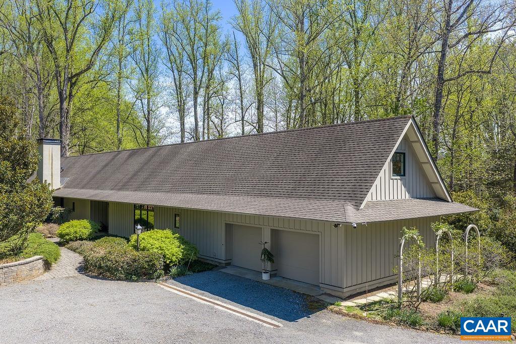 LOCATION and privacy are just a few of the highlights in this custom-built (Abrahamse & Company Builders, 2006) residence located just minutes from the beautifully historic Farmington Country Club. The property is adjacent to a 224-acre tract of land owned by the University of Virginia Foundation. The floor plan was carefully designed with both elegance and comfortability in mind. Ten-foot ceilings, large formal dining room, glazed radiant concrete floors throughout entire 1st floor, 2 separate vanities/private water closets in primary bath with shared walk-in shower, charming screen porch private to primary suite, abundance of built-ins, storage and so much more. Mature landscaping surrounds the property with stone walking paths and towering hardwoods create an outdoor feast for the eyes.,Solid Surface Counter,Wood Cabinets,Fireplace in Family Room