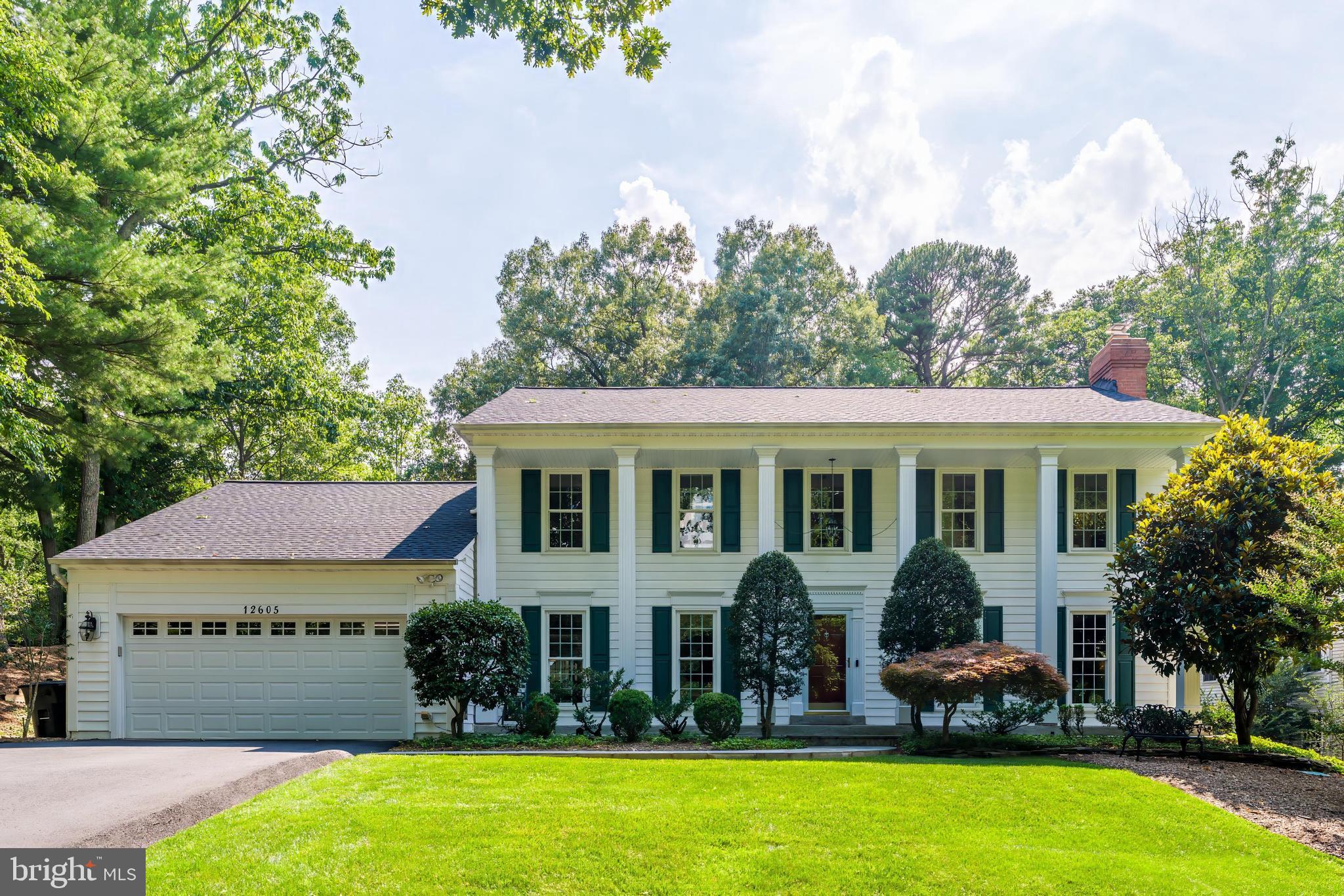 Nestled on a spectacular 0.84-acre wooded lot in the highly sought-after Franklin Farm community, this exceptional colonial has been thoughtfully renovated from top to bottom, offering the perfect blend of timeless elegance, modern comfort, and everyday functionality. With five bedrooms, three-and-a-half bathrooms, beautifully updated living spaces, and an incredible outdoor retreat, this is a home designed for both relaxed living and effortless entertaining. A stately approach begins with the charming covered front porch and flagstone walkway, creating a warm first impression that reflects the meticulous care found throughout the home. Inside, a gracious foyer welcomes you with gleaming hardwood floors that extend throughout the main and upper levels, including the staircase. Rich crown molding and chair rail detailing add classic architectural character while creating an elevated, refined atmosphere. The formal living room is anchored by a beautiful gas fireplace and flows seamlessly into a private home office, providing an ideal work-from-home space that offers both privacy and comfort. The expansive dining room, highlighted by dramatic floor-to-ceiling windows, is filled with natural light and offers the perfect setting for hosting holiday gatherings and memorable celebrations.  The inviting family room features a second gas fireplace and opens effortlessly to the outdoor living spaces, making indoor and outdoor entertaining feel seamless. The beautifully renovated chef's kitchen is as functional as it is stylish, featuring custom cabinetry, granite countertops, a spacious peninsula with seating, breakfast nook, built-in desk area, and a convenient butler's pantry that provides exceptional storage and serving space for everyday living or large gatherings.  Upstairs, the luxurious primary suite serves as a peaceful retreat. The spa-inspired ensuite has been beautifully renovated with timeless, neutral finishes and features a dual vanity, separate shower, soaking tub, and thoughtfully designed dressing area. A large walk-in closet with a custom organization system provides abundant storage. Three additional generously sized bedrooms offer excellent closet space, abundant natural light, and ceiling fans, while the fully renovated hall bath showcases today's most desirable finishes, providing comfortable accommodations for family and guests alike. The fully finished lower level expands the home's versatility with abundant additional living space. A spacious recreation room offers endless possibilities for game nights, movie marathons, or casual gatherings, complete with a wet bar. A bonus room provides flexibility for a home gym, hobby room, or playroom, while the fifth bedroom and full bath create the perfect private guest suite or multigenerational living space. The outdoor living experience is truly exceptional and rarely found. The family room opens to a stunning screened porch where you can enjoy peaceful mornings and relaxing evenings surrounded by nature. An expansive deck with a built-in grilling station and covered trellis creates the ultimate space for outdoor dining and entertaining. Beyond the stone steps, the expansive flat, wooded backyard offers remarkable privacy and endless room for recreation, gardening, play, or simply enjoying the beauty of the surrounding landscape. Living in Franklin Farm means enjoying one of Northern Virginia's most beloved communities, offering an unmatched lifestyle with neighborhood pools, walking trails, parks, playgrounds, tennis and pickleball courts, basketball and volleyball courts, fishing ponds, and year-round community events. Residents also appreciate the highly rated schools and the exceptional convenience of being just minutes from shopping, dining, and major commuter routes.  Roof 2023, HVAC 2018, H20 Heater 2022.  This remarkable property offers the rare opportunity to enjoy luxurious indoor living, extraordinary outdoor spaces, and an unparalleled community lifestyle.