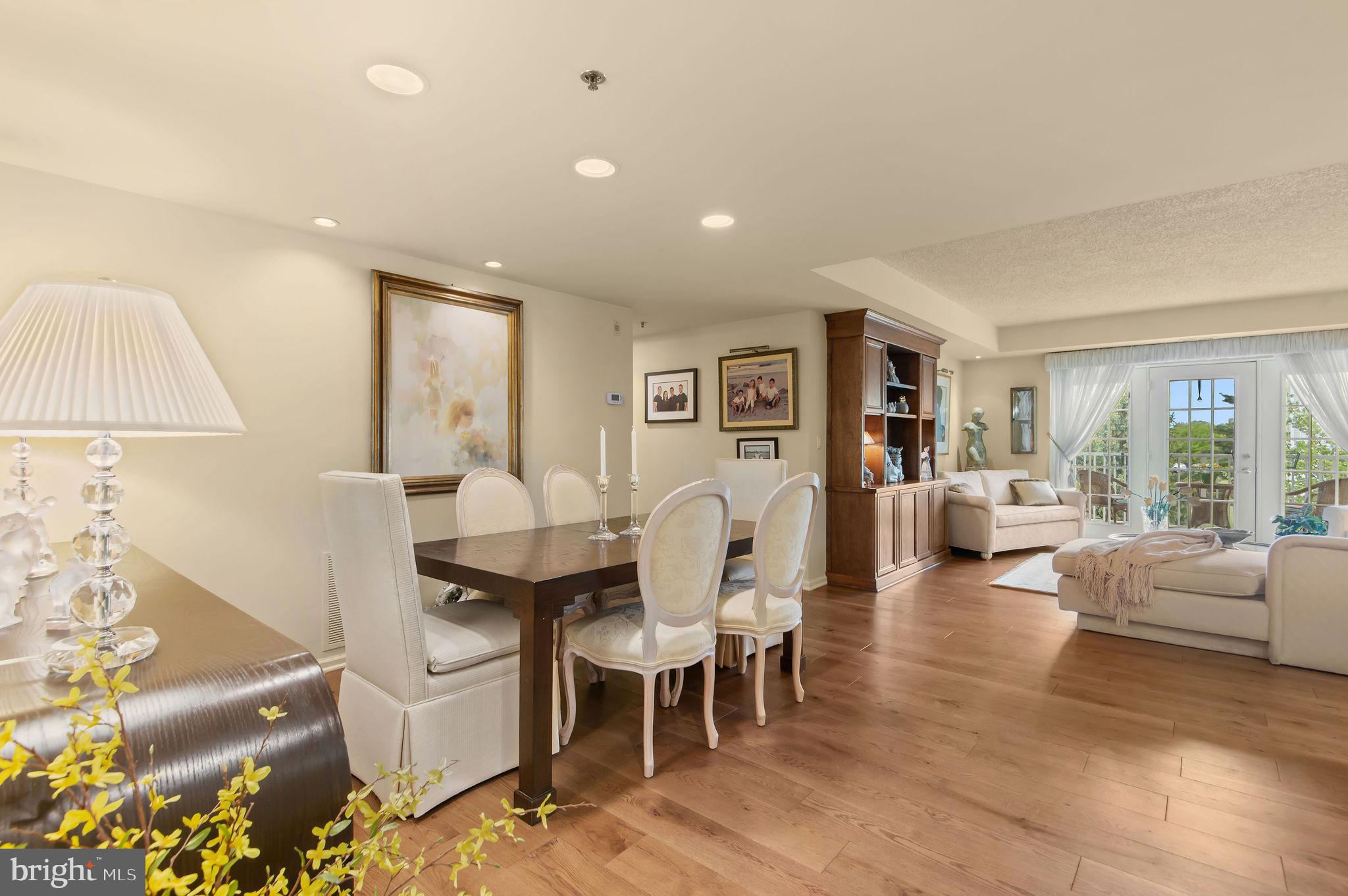 If you are 55 Plus and have been waiting for a perfect move-in ready home, your wait is officially over!   This inviting 55+ Condominium at Centennial Station offers a comfortable and convenient vacation-like lifestyle at an affordable price.  At almost 1,500 square feet, this 3rd Floor custom-built Osprey Deluxe model is in immaculate condition and truly shows like a Sample Home. Immediately upon entering, great attention to detail is evident everywhere.  The owner spared no expense with the installation of beautiful real hardwood  flooring in the entertaining areas, custom paint, a handsome built-in Living Room Bookcase, and extensive recessed lighting.  They even undertook the expense of upgrading the ceilings to drywall instead of the builder's standard drop ceilings.  Without a doubt, the heavily customized and upgraded kitchen is the crown jewel of this property. Wide open and gleaming, it is a delightful space with everything you need, including new stainless refrigerator/dishwasher, newer microwave/range, plenty of upgraded cabinets and a goose neck faucet with a stainless steel sink.  The raised 9 foot tray ceiling, open Granite Peninsula and Quartz counters accented by ceramic subway tile  make this kitchen both functional and stylish. The main bedroom is truly grand, boasting replacement windows, an immense professionally organized double walk-in closet and a full bath with stall shower, oversized vanity and recessed linen closet. The second bedroom is also generously sized, featuring another professionally organized walk-in closet, like-new berber carpet, and built-in bookcase. Across from the 2nd bedroom is your 2nd Full Bath with a tub-shower combination.   For added convenience, there is an actual laundry room with a full-size washer and dryer and new hot water heater off the 2nd Bath. Don't worry about downsizing from your single home.   This spacious condo feels more like a 2 Bedroom Rancher than a condo and has all the room you're likely to need. The open Courtyard view from the tiled balcony is the icing on the cake.  And you have even more storage in the 6 x 6 storage closet off the balcony.  Located in a dramatic sky-lit atrium building not found in any of the other local active adult communities. Building 6 is also notable for the fact that it has 3 different entrances with convenient parking off of each of those entrances.  You'll get the convenience and low maintenance advantages of a condominium blended with single home features.  The Building has a large Otis Elevator As Well As Sprinklers Throughout Units And Common Areas. Fee Includes Trash, Snow, Water, Sewer, Cable T.V. Security System Monitoring, Master Policy Insurance Plus Activity Center W/Indoor Year-Round heated 25MPool,Exercise Room, Card Room, Billiard Room, And Meeting/Banquet Room. Commercial Wing Has convenient Real Estate Office offering free Notary, Faxing, and Copying, Restaurant, Hair Salon, and Dentist. No dogs except certified service/support animals. Only one resident has to be 55 yrs old provided all other full time residents are over the age of 18.