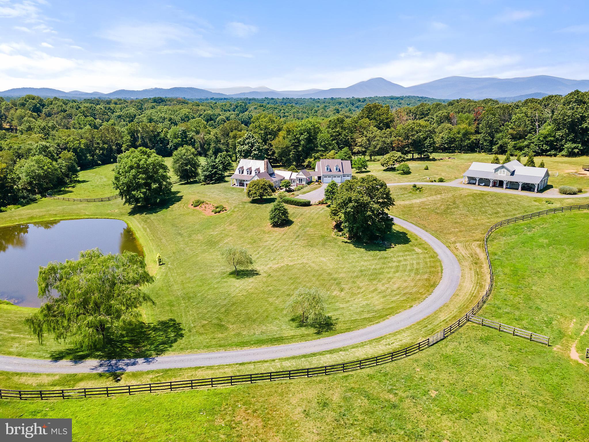 This spectacular property, located in the heart of Virginia's Piedmont, is filled with special features!  41 rolling acres, privately situated with lovely mountain views, stocked pond and breath-taking vistas from every window.  This custom-built home has a lovely, open floor plan with a main level master suite, complete with a private screened porch.  The great room has a stunning stone fireplace.  The main level also features a library, spacious kitchen, dining room with French doors leading to porch, and a sunroom and breezeway that leads to the garage.  The upper level has a sitting area/loft and 2 bedrooms, each with a private bathroom.  The basement offers lots of storage and has possibilities for future build out.  This home was built with the finest materials - hardiplank siding, brand new metal roof, custom walnut cabinets, Baldwin hardware and more.  The exterior has many places to enjoy being outdoors - covered wrap-around porch, stone patio, walking trails or fishing in the pond.  The over-sized 3 car garage is connected to the house by a covered breezeway.  Above the garage is a beautiful suite with kitchen, living area, sleeping area, full bath.  The center aisle barn has 7 stalls, Dutch doors, stall screens, feed room, grooming area, heated tack room and full stairs to hayloft which holds 350+ bales of hay.  The property is located in the heart of Old Dominion Hunt and is surrounded by riding trails.  PLEASE DON'T DRIVE ONTO THE PROPERTY WITHOUT AN APPOINTMENT. DON'T FORGET TO CLICK ON THE CAMERA ICON TO VIEW THE VIDEO OF THIS BEAUTIFUL PROPERTY!