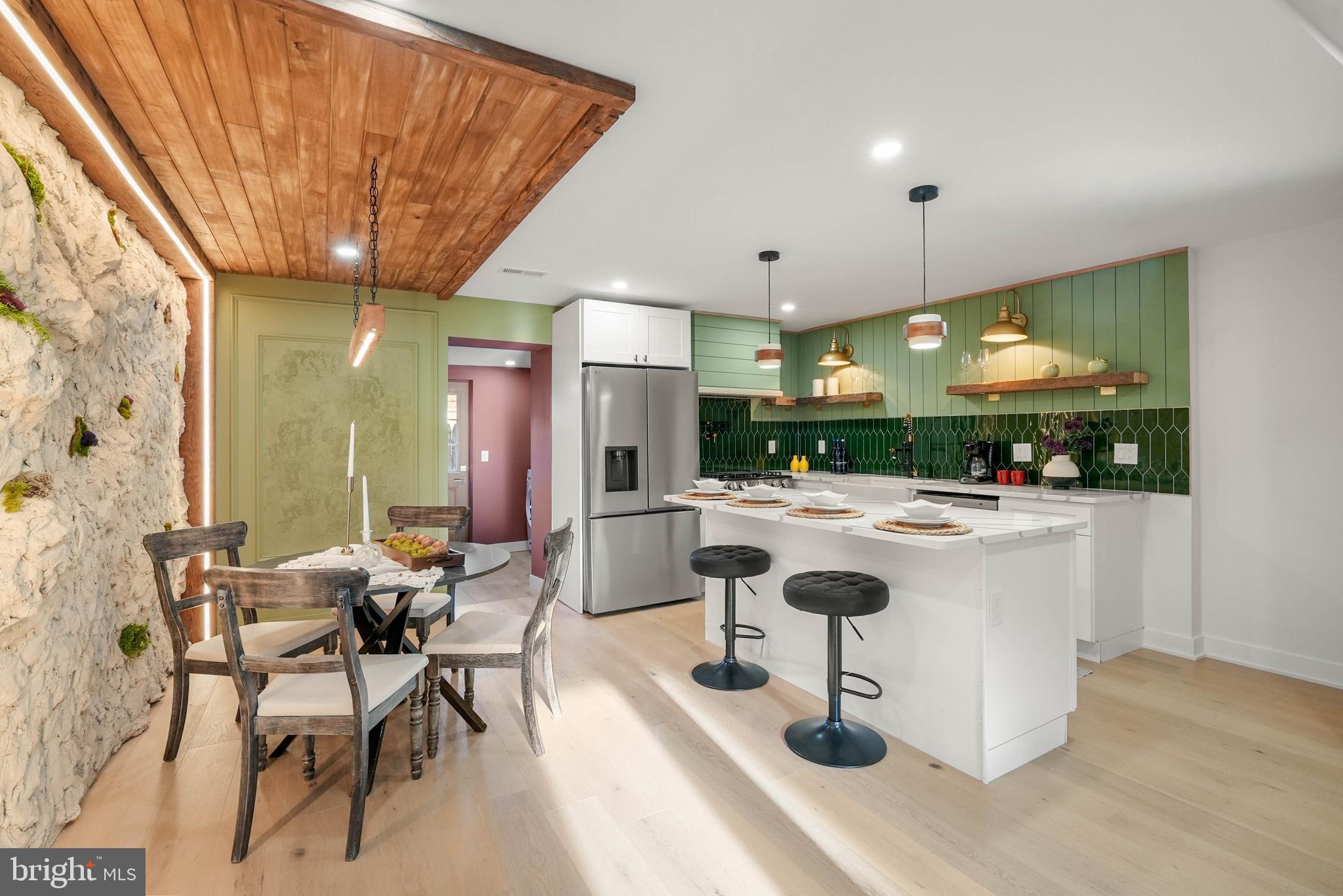 Step into a beautifully designed home where custom finishes, a chef-inspired kitchen, and thoughtful details come together to create the perfect blend of style and comfort. Welcome to 2429 N Mascher Street, a stunningly renovated residence in the heart of Norris Square, complete with a 10-year tax abatement and crafted to deliver a truly elevated living experience.
The open-concept main level showcases wide-plank engineered hardwood floors, elegant shadowbox molding, designer lighting, and a custom fireplace with built-in arched shelving that anchors the living space with warmth and character. Every detail has been carefully curated to create a sophisticated yet inviting atmosphere.
The kitchen is a true showpiece, featuring sleek quartz countertops, custom cabinetry, a statement built-in hood vent, premium 5-burner gas range, and a spacious island accented by elegant brass finishes—perfect for both everyday living and entertaining.
On the second level, you’ll find two generously sized bedrooms along with a beautifully finished full bathroom featuring custom tile work. The third floor is dedicated to a stunning primary suite filled with abundant natural light, featuring a custom accent wall, built-in TV feature with shelving and LED lighting, dual walk-in closets, and a spa-inspired ensuite bathroom complete with a freestanding soaking tub, floating double vanity, oversized walk-in shower with a custom tile niche, and elegant brass fixtures throughout. The third level also features a versatile fourth bedroom, perfect for a guest room, nursery, or private home office.
Additional highlights include a stylish main-level powder room and a dedicated laundry area complete with built-in shelving and designer finishes. Step outside to a private rear yard offering a clean, low-maintenance space ideal for relaxing or entertaining. OPEN HOUSE Sat 5/30 & Sun 5/31 11:00-1:30pm