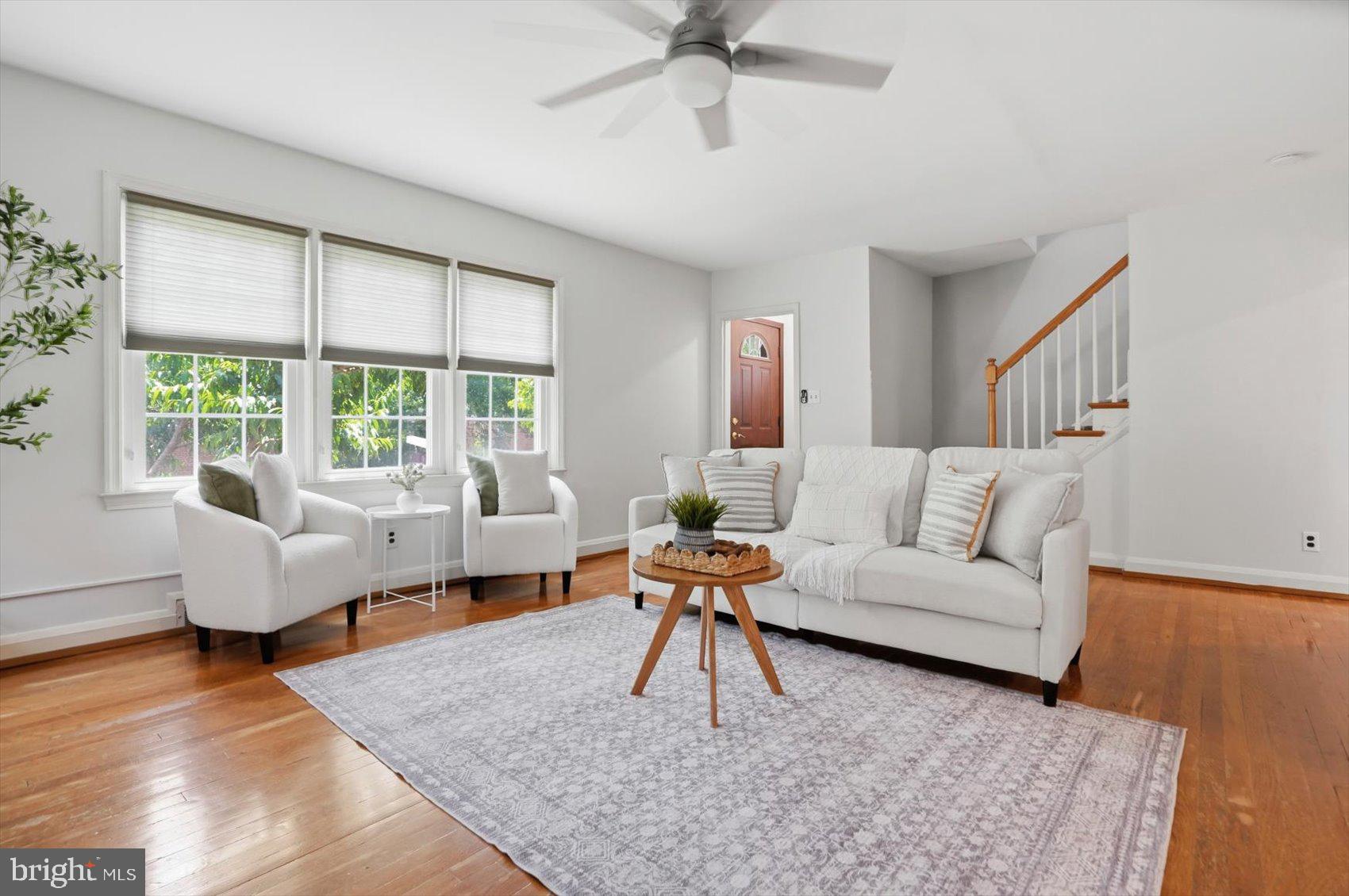Welcome home to this charming end-of-group rowhome offering 3 bedrooms, 1 full bath, and 1 half bath, thoughtfully updated while maintaining its classic character. Beautiful real hardwood flooring flows throughout the home, complemented by updated lighting fixtures, recessed lighting, and a cozy wood-burning fireplace that creates a warm and inviting atmosphere.

The heart of the home is the updated kitchen, renovated in 2022 and designed with both style and functionality in mind. Featuring stainless steel appliances, a gas range, a center island with sink and gooseneck faucet, and an open-concept layout to the dining area, this space is perfect for everyday living and entertaining alike.

The lower level adds valuable living and storage space and includes a convenient half bath, custom built-ins, and attractive real wood paneling that adds warmth and character.

Numerous improvements provide added comfort and peace of mind, including newer windows, a brand-new furnace installed in 2025, an Aeroseal duct sealing system, a radon mitigation system, and Home Performance Energy Star certification for enhanced energy efficiency.

Outside, enjoy the benefits of an end-unit location with additional natural light and outdoor space. Outdoor garden lighting conveys in as-is condition. This well-maintained home offers a wonderful combination of charm, updates, and efficiency, making it truly move-in ready.