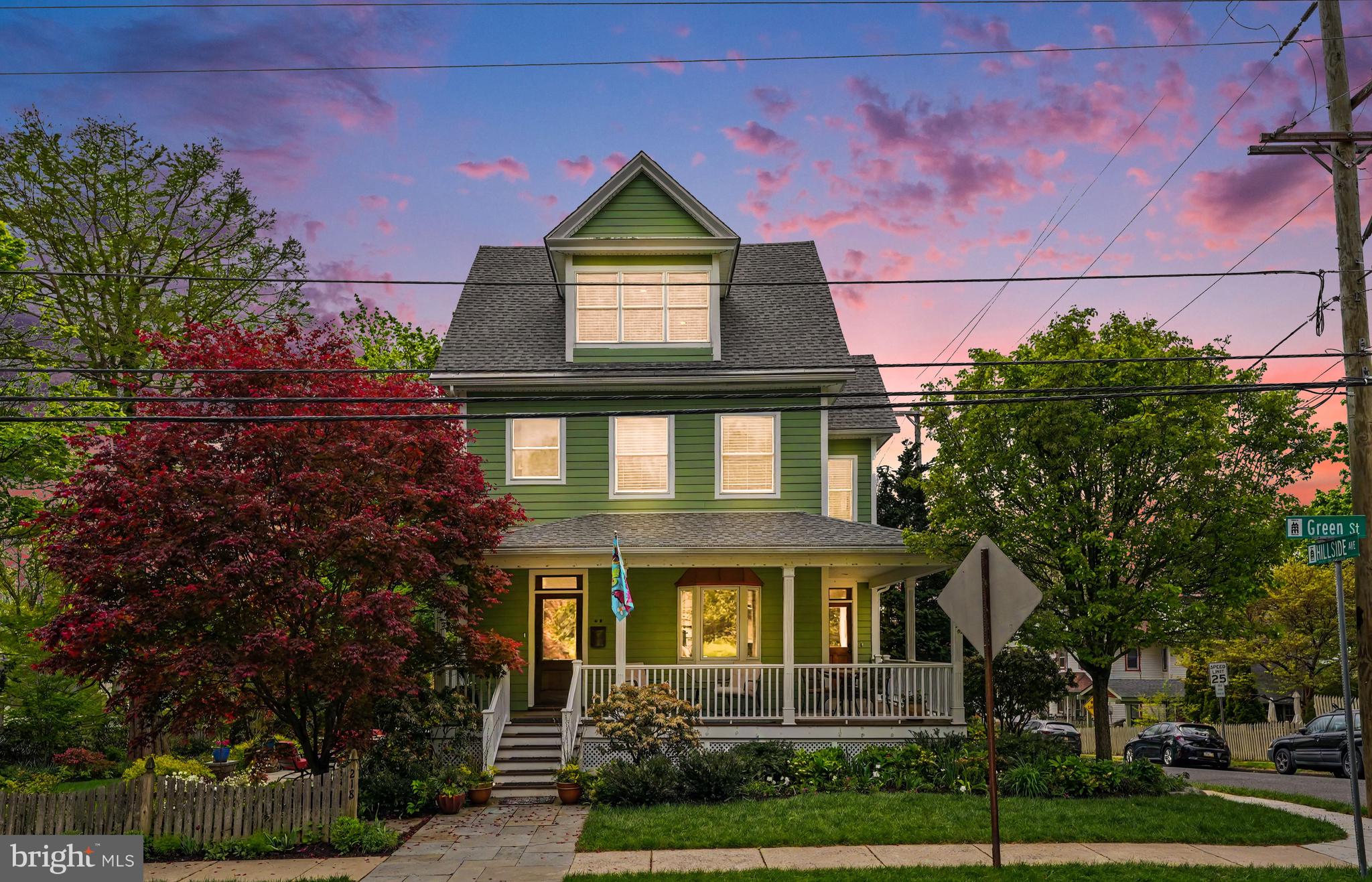This exceptional home in Doylestown Borough perfectly blends timeless Victorian charm with today’s sought-after amenities. Built circa 1901 and thoughtfully updated for modern living. A beautiful wraparound porch welcomes you into a home rich with character, featuring original pumpkin pine flooring throughout the first and second levels, stunning woodwork, pocket doors, an original banister, tall base moldings, authentic back staircase, and thoughtful expansion of the house.
The spacious kitchen is designed to impress with a vaulted ceiling, generously sized center island, granite countertops, custom cherry cabinetry with hardwood drawers, ceramic tile flooring, recessed and under-cabinet lighting, ceiling fans, pantry, tile backsplash, breakfast area, and 3-panel French doors leading to the deck. The first floor also offers a formal living room, elegant dining room with access to the front porch, media/library room, powder room, laundry room, and convenient side entry.
Upstairs, the second level features three spacious bedrooms, including one currently used as a music room/office, a full hall bath, and an oversized linen closet with potential for a second-floor laundry area.
Occupying the entire third floor, the fully renovated primary suite is a true retreat. This private oasis includes built-in storage, a charming alcove, barn door, recessed lighting, separate HVAC, engineered hardwood flooring, and upgraded foam insulation throughout the walls and ceiling. The luxurious ensuite bath showcases an oversized glass-enclosed shower, dual separate vanities with leathered granite counters and vessel sinks, heated floors, and a large walk-in closet.
The clean and organized basement offers abundant storage, a dedicated wine room with racks, access to the garage, and utility space. A two-car garage includes additional storage and a Level 2 EV charger.
The outdoor living spaces are equally extraordinary. Step from the deck down to a welcoming flagstone patio surrounded by magnificent professionally designed gardens, recognized on past Doylestown garden tours. Wander through beautifully contoured garden beds filled with native plantings, mature trees, fragrant blooms, and lush lawn areas. Whether entertaining guests, relaxing with a book, or dining al fresco, this remarkable outdoor setting offers beauty and tranquility in every season.