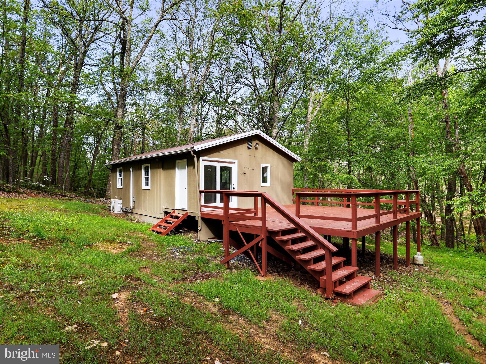 1 bedroom, 1 bathroom newly renovated cabin in the mountains on almost 3.5 acres!  Make this your full time residence, weekend getaway or your new short term rental/airbnb!  This home features LVP flooring throughout, updated lighting, fresh paint inside and out, brand new HVAC, and a new kitchen featuring quartz countertops and stainless steel appliances.  Also can be found as 153 Bear Turnaround Rd.