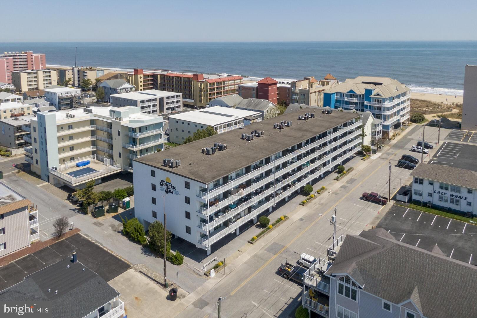Back on the Market! Buyer did not perform so NOW is your chance! Move-in ready and Fully furnished! Experience the charm of Sun Rise Sea 208, where convenience and coastal charm come together in perfect harmony. Ideally nestled in mid-town Ocean City, this 2-bedroom, 2-bath condo spans 996 square feet and is situated on the 2nd floor, providing a coastal retreat with captivating views.

The spacious 25-foot southern-exposure balcony is perfect for soaking in stunning sunsets over the bay and breathtaking sunrises over the ocean. Just steps from the beach, you can have your toes in the sand within minutes.

This building offers an array of amenities, including the convenience of an outdoor pool, an elevator for easy access, a bike rack, and ample under-the-building parking to ensure your car stays cool on hot summer days while being protected from the elements. Whether you're seeking a private escape or a lucrative rental investment, this condo opens doors to endless possibilities.

Situated in the vibrant heart of mid-town, you'll enjoy unparalleled convenience with nearby shopping, a diverse array of eateries, and reliable public transportation.

Embrace this ultimate beachy vacation lifestyle—the sun and sand are waiting for you!