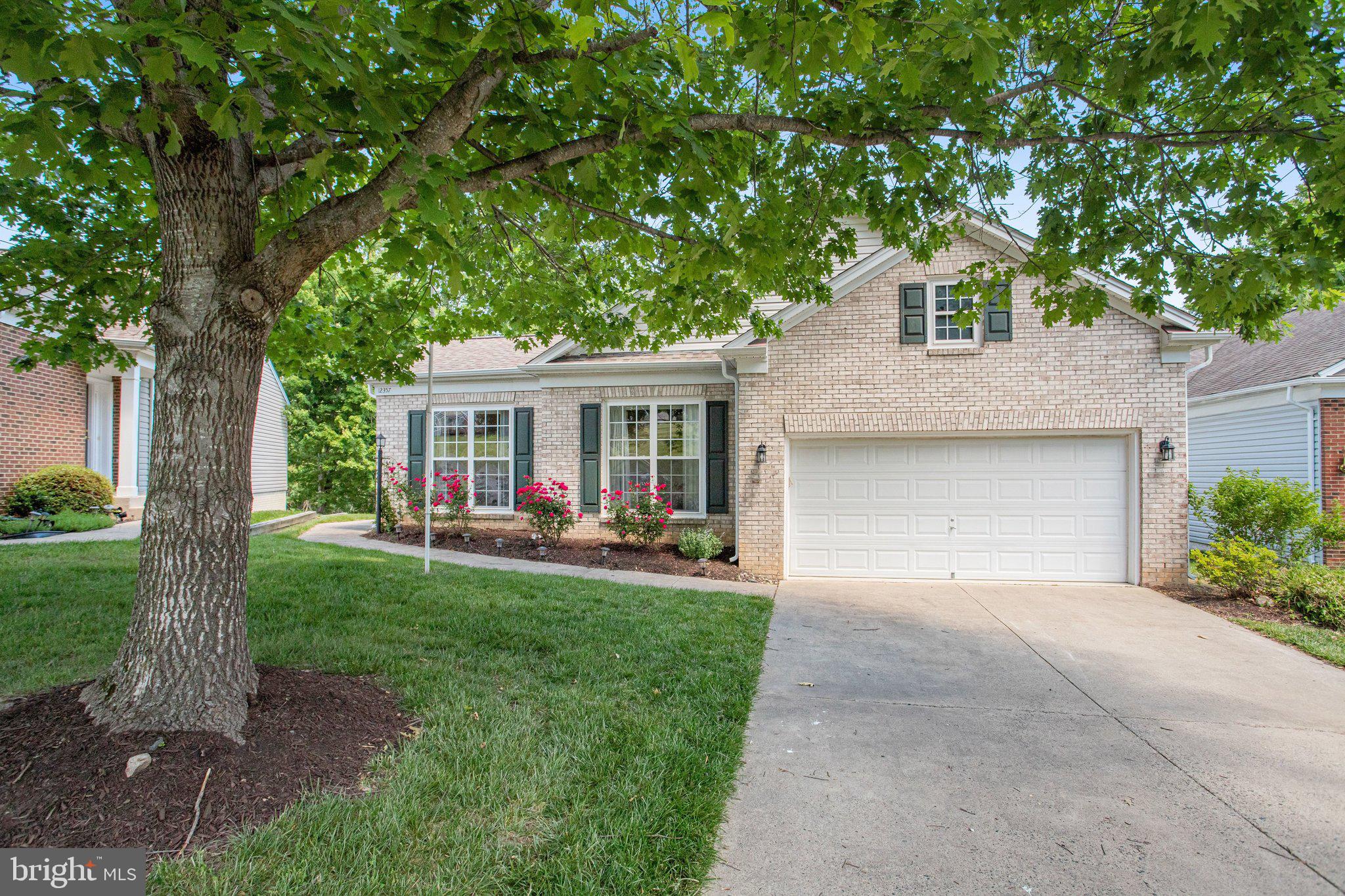 Tucked inside the gates of sought-after River Ridge, this rarely available detached Vanderbilt model offers the perfect blend of elegance, comfort, and active-adult lifestyle living. One of the larger homes in the community, this beautifully maintained residence features over 4,000 square feet of finished living space including a spectacular walkout lower level designed for entertaining and everyday enjoyment. The main level showcases true one-level living with a spacious primary suite, second bedroom, private study, formal living and dining rooms, and an open-concept kitchen flowing seamlessly into the inviting family room. The expansive screened porch overlooking the backyard creates the perfect indoor-outdoor lifestyle rarely found in 55+ communities. The finished walkout lower level offers an enormous rec room, an additional family room, a third bedroom, a large storage room, and a large rear deck, ideal for guests, hobbies, entertaining, or multigenerational living flexibility. River Ridge is a gated active-adult community known for its clubhouse, pool, social atmosphere, and beautifully maintained grounds, all conveniently located near shopping, dining, medical facilities, Occoquan, and major commuter routes. Additional highlights include main-level laundry, spacious entertaining areas, and the rare combination of warmth, privacy, and lifestyle that active-adult buyers wait for.
