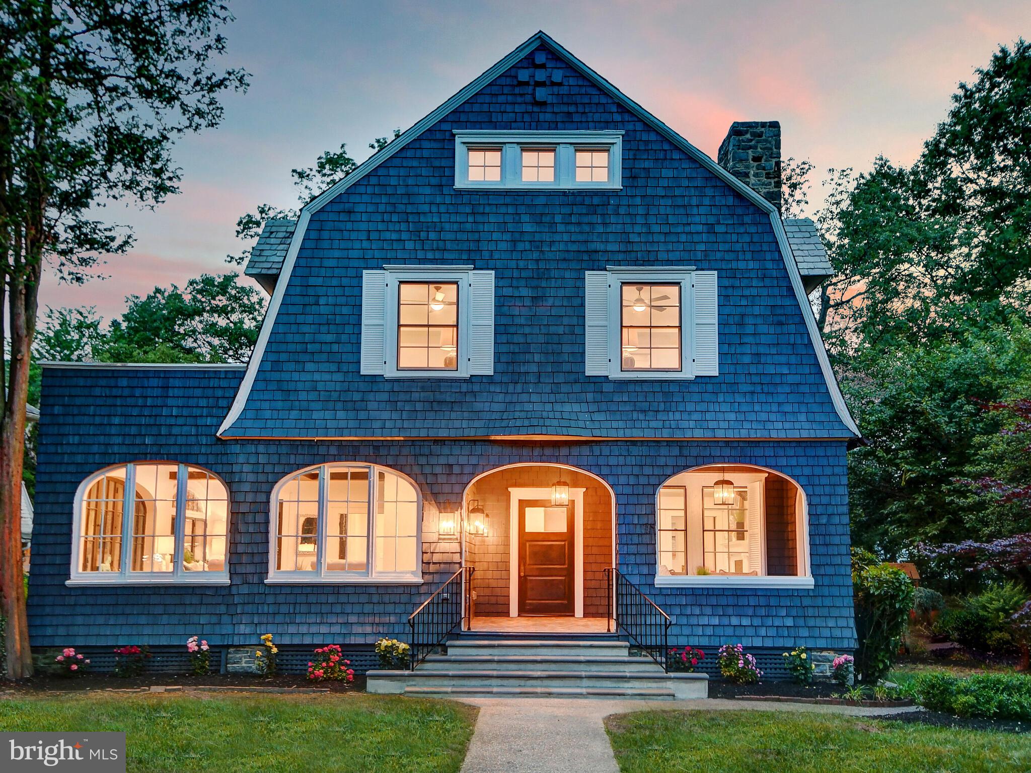 Drama, elegance, detail and space are abundant in this fully renovated Roland Park home. Original details shine throughout with unique moldings, curved railings, intricate leaded glass windows, and oversized arched windows that have been restored to their original glory.  Modern conveniences accent the antique details perfectly with a designer kitchen featuring black and white Carrera quartz counters which opens to the dining and living areas. The spacious first level also offers a formal living room with the original wood burning fireplace, a sundrenched family room, an extra office, powder room, mud room and pantry. The second level is home to a generous primary bedroom suite which includes an ensuite primary bath, an impressive walk-in closet with island, a wine bar enclave, and even an exterior patio to relax and enjoy your glass while overlooking the grounds. Also on the second level lies 2 more bedrooms with their own baths, and a fabulous well equipped laundry room. Up the stairway to the third level, you will discover 3 more bedrooms and a hall bath. One bedroom is large enough to be used as flexible space for a playroom, etc. The lower level is also large, fully functional and is currently being used as storage and work bench area. Outside, the beautiful grounds of the home offer many outdoor living spaces including a raised deck, a ground-level patio and enormous flat, fully fenced in backyard. The front of the home is perfectly set back with an extended front yard. This exquisite historic property is conveniently located within minutes from downtown and Hopkins as well. Roland Park is an extraordinary walking neighborhood with a perfect mix of hills and level streets, plus a web of hidden footpaths interspersed to connect the streets... and add interest!