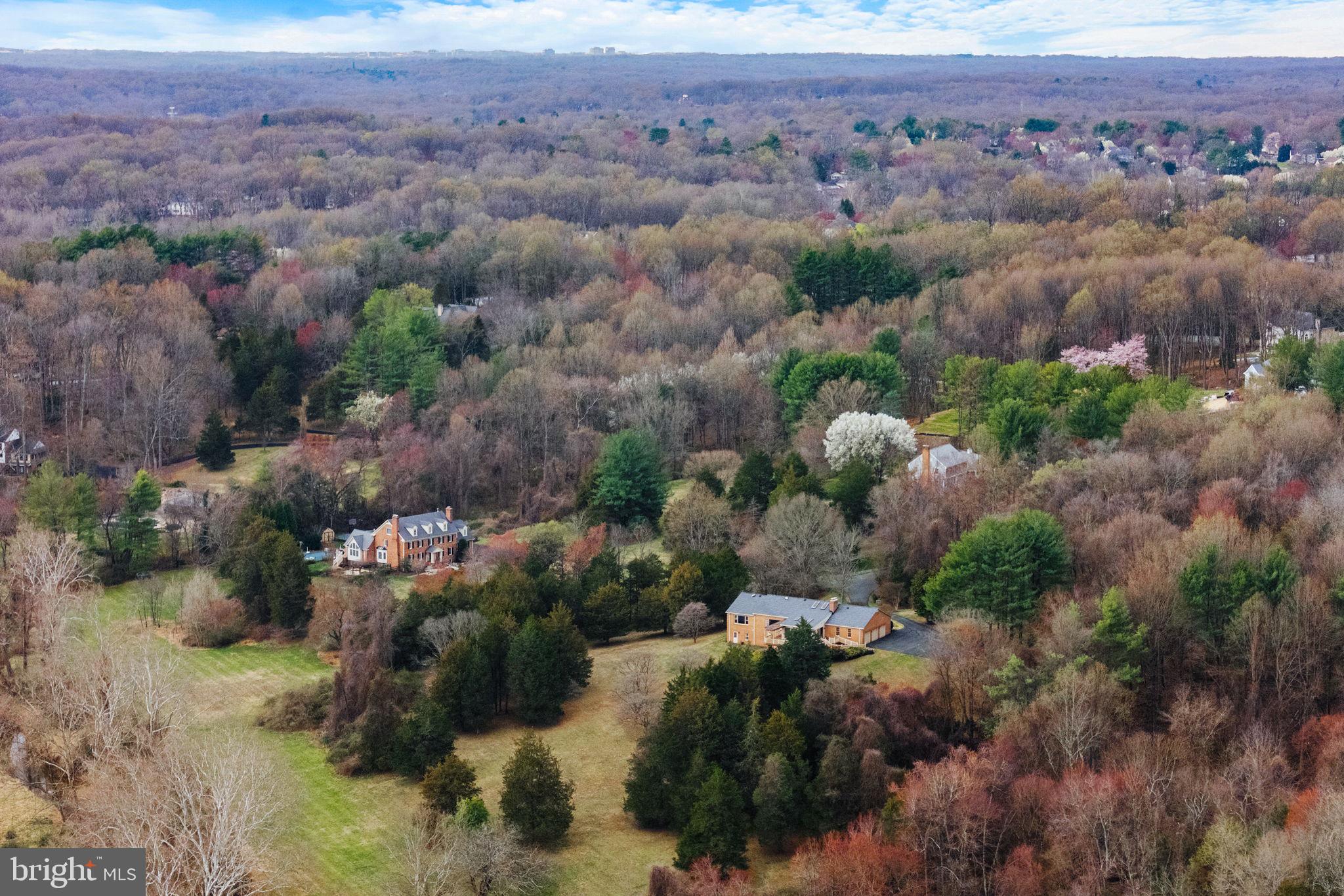 Location location location!!

Conveniently situated between the Dulles Toll Road and Leesburg Pike in Vienna, yet remaining utterly rural, this exceptional 5-acre property offers a rare blend of natural beauty, privacy, and convenience. Gently sloping terrain leads from an existing home, in need of full rehab or demolition and rebuild, down to the picturesque Difficult Run stream, with Fairfax County park land just beyond, offering a unique opportunity to acquire a serene retreat just minutes from the vibrant culture of Wolf Trap National Park for the Performing Arts and Tysons Corner.

For the first time since its construction in 1980, the classic brick ranch/rambler is now available for new owners to renovate, expand, or build their dream estate.

There is no homeowners association, just a road maintenance agreement with an annual contribution to the road maintenance fund.

The possibilities are endless on this park-like, expansive, tree-lined parcel, where mature hardwoods, open grassy areas, and a pleasant water feature create a truly special setting.