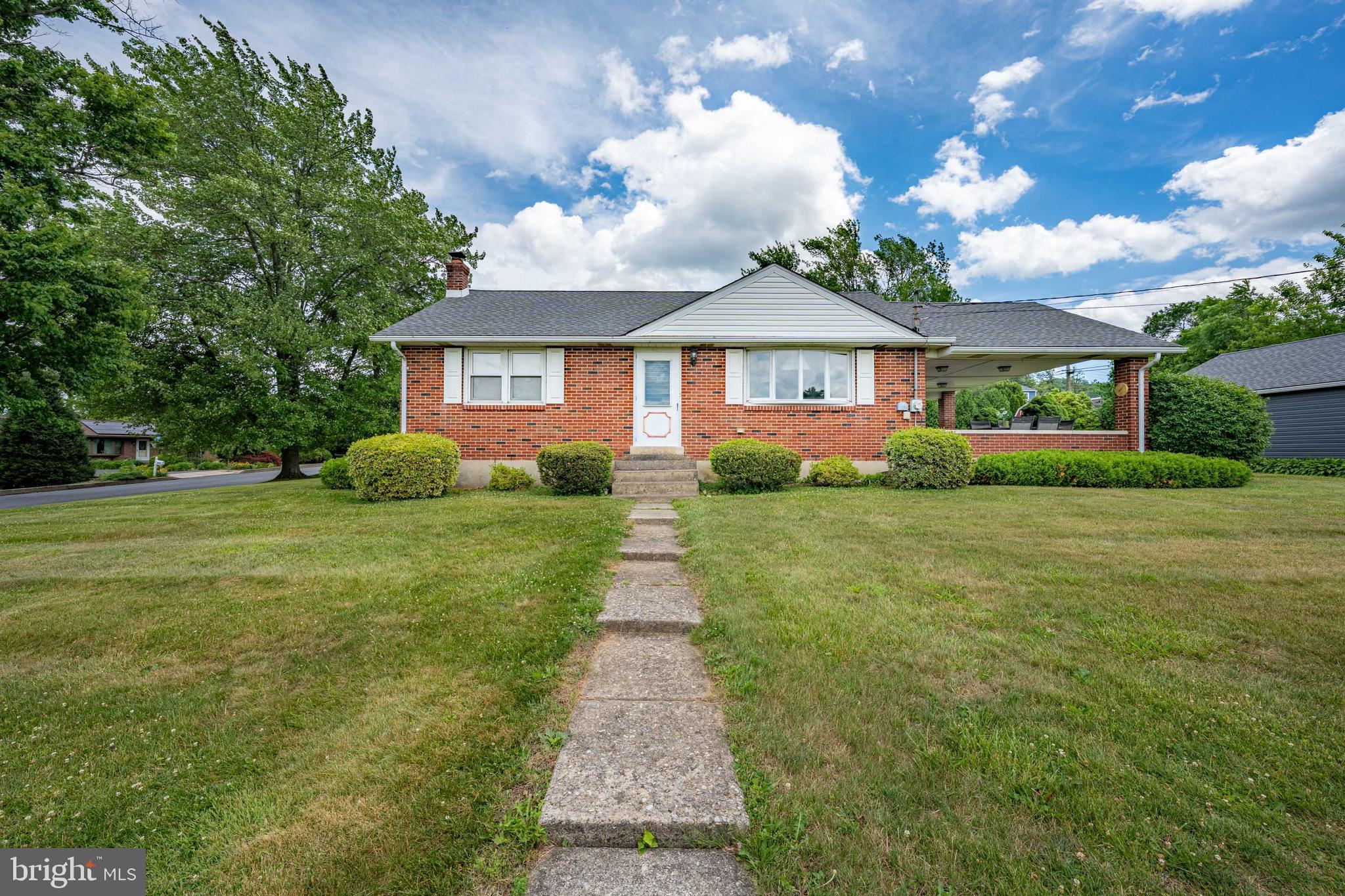 Welcome home to this well-maintained brick ranch nestled on a spacious corner lot in the highly desirable Emmaus area. Offering 3 bedrooms, 1.5 bathrooms, a detached 2-car garage, and a finished basement, this property presents an incredible opportunity for first-time home buyers, growing families, or anyone looking for single-floor living with room to expand. Step inside and you'll find beautiful hardwood floors, a bright and inviting living room filled with natural light, and a functional eat-in kitchen. Three comfortable bedrooms and a full bath complete the main level. One of the standout features of this home is the oversized covered side porch. Large enough to accommodate both a dining area and a separate seating space, it creates the perfect setting for summer dinners, morning coffee, family gatherings, and entertaining guests regardless of the weather. Downstairs, the finished basement offers endless possibilities. Featuring a built-in bar, spacious recreation area, half bath, dedicated laundry room, and an additional room ideal for a home office, hobby room, gym, or flex space, this level simply needs a little cosmetic updating to unlock its full potential. New flooring and a fresh vision could transform this area into an incredible entertainment hub or family room. Outside, you'll appreciate the detached two-car garage, storage shed, mature landscaping, and generous yard space perfect for kids, pets, gardening, or outdoor activities. Located within the highly regarded East Penn School District and just minutes from shopping, dining, parks, recreation, and major commuting routes, this home combines small-town charm with everyday convenience. Emmaus is known for its family-friendly atmosphere, strong community feel, excellent schools, and easy access to the Lehigh Valley. Nearby schools include Macungie Elementary School, Eyer Middle School, and Emmaus High School. This is the type of home where memories are made. Schedule your private showing today