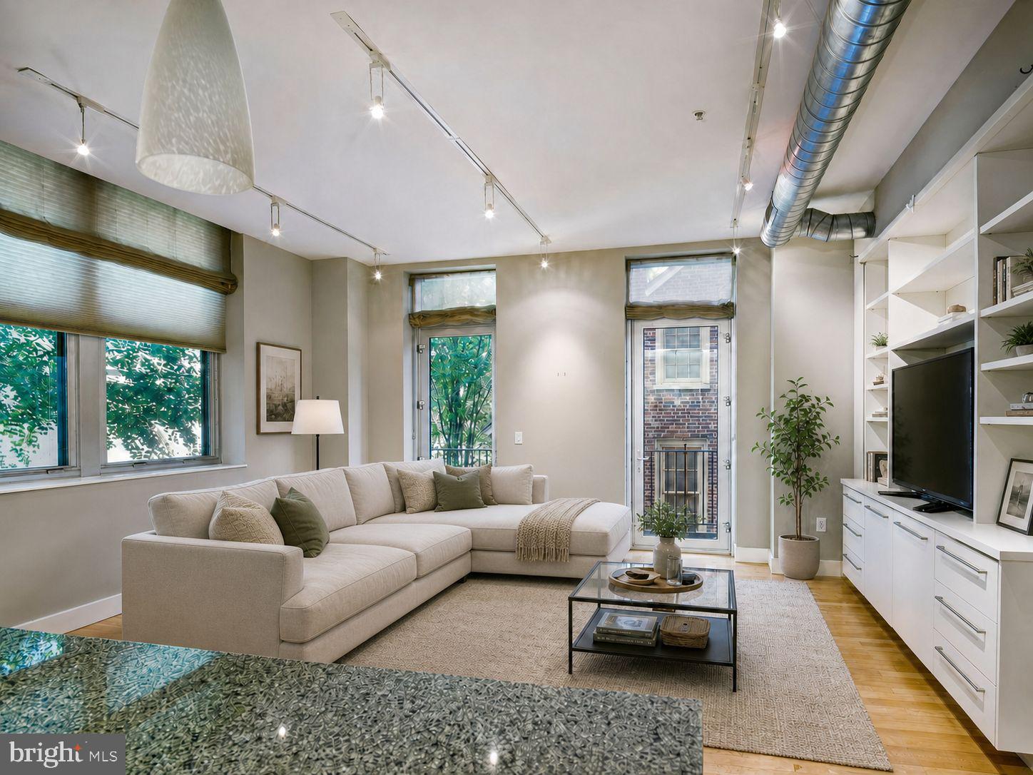 Welcome to residence 2I at the Western Union — one of Center City's most storied addresses. This exceptional corner home offers three bedrooms, a versatile den, and two full baths across an open and airy floor plan, filled with natural light from oversized windows on two exposures. Soaring ceilings and gleaming hardwood floors set a sophisticated tone throughout, while the private balcony extends your living space outdoors.
What truly sets this residence apart is a combination rarely found in Center City high-rise living: three dedicated storage units and one-car garage parking — an unmatched package of convenience for the urban homeowner.
The gourmet kitchen is appointed with stainless steel appliances, granite countertops, and a generous island ideal for casual dining and entertaining. Both bedrooms are generously sized with oversized walk-in closets, and the spa-inspired primary bath features marble tile, a double vanity, soaking tub, and separate glass-enclosed shower. The den adapts effortlessly to your lifestyle — home office, media room, or guest space.
All of this within the landmark Western Union Building, a 12-story adaptive reuse of Philadelphia's historic 1920s Western Union Telegraph headquarters, designed by Cecil Baker. Building amenities include 24-hour concierge, fitness center, and pet-friendly policies, with condo fees covering water and gas cooking. Positioned at the crossroads of Washington Square West and the Avenue of the Arts, you're steps from acclaimed dining, Jefferson Health, and the energy of one of Philadelphia's most walkable neighborhoods.